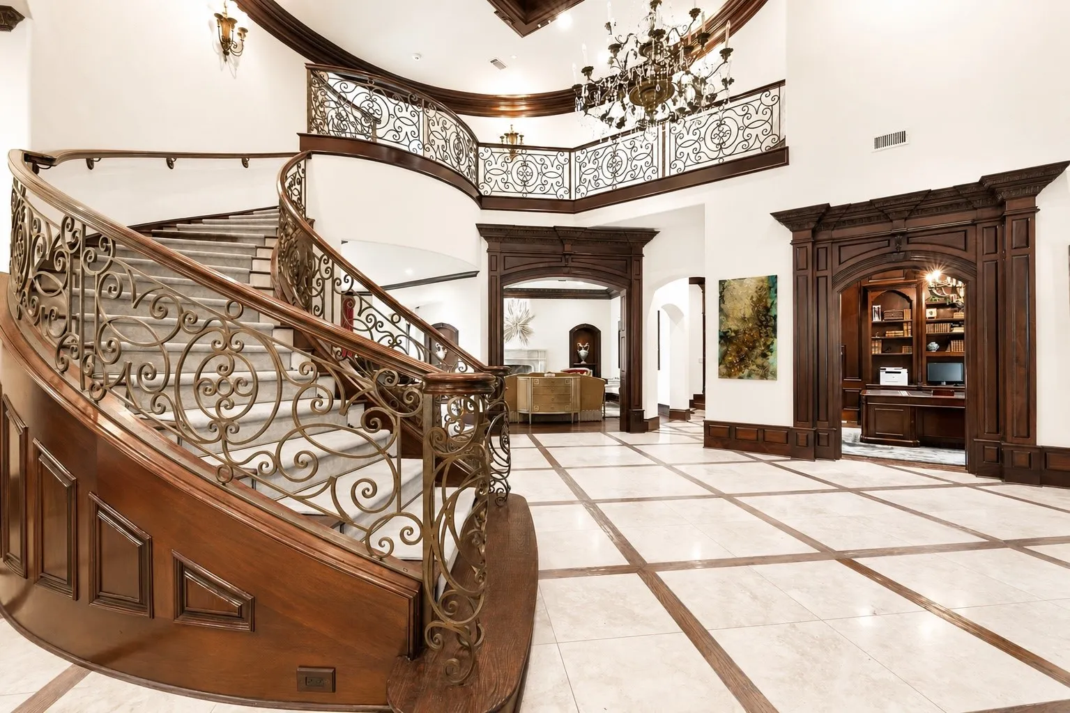 Elegant luxury foyer with curved staircase
