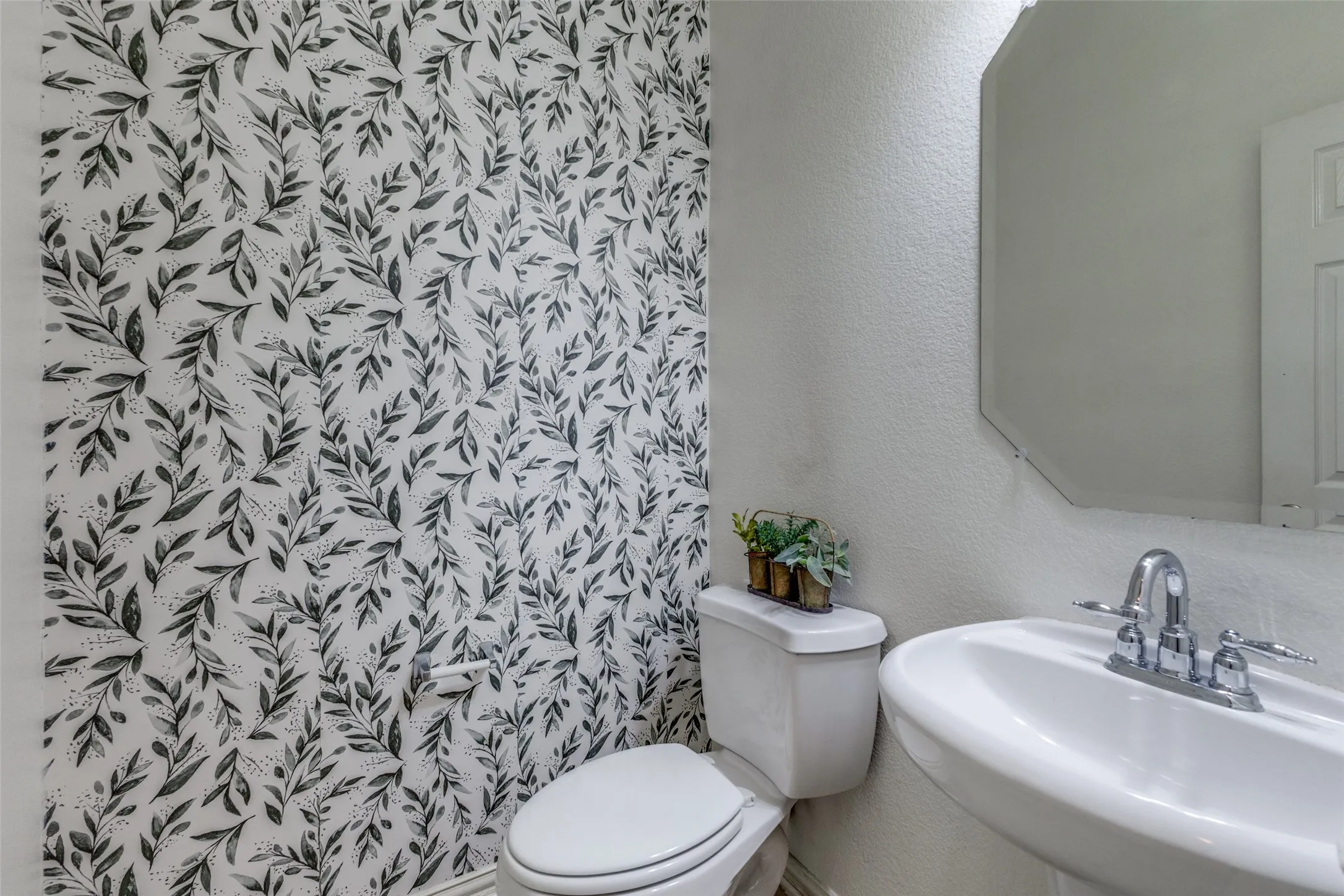 Convenient half bath located downstairs for guests.