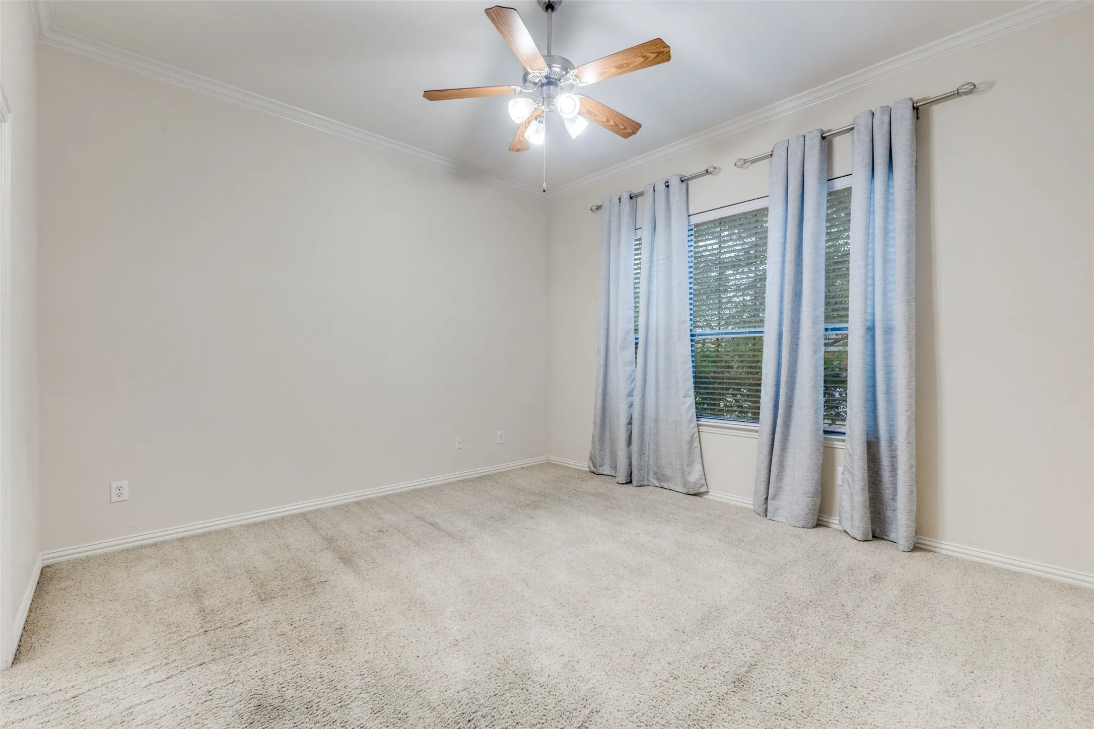 The primary bedroom is split for privacy.  Located downstairs, it features lots of room and an ensuite bath.