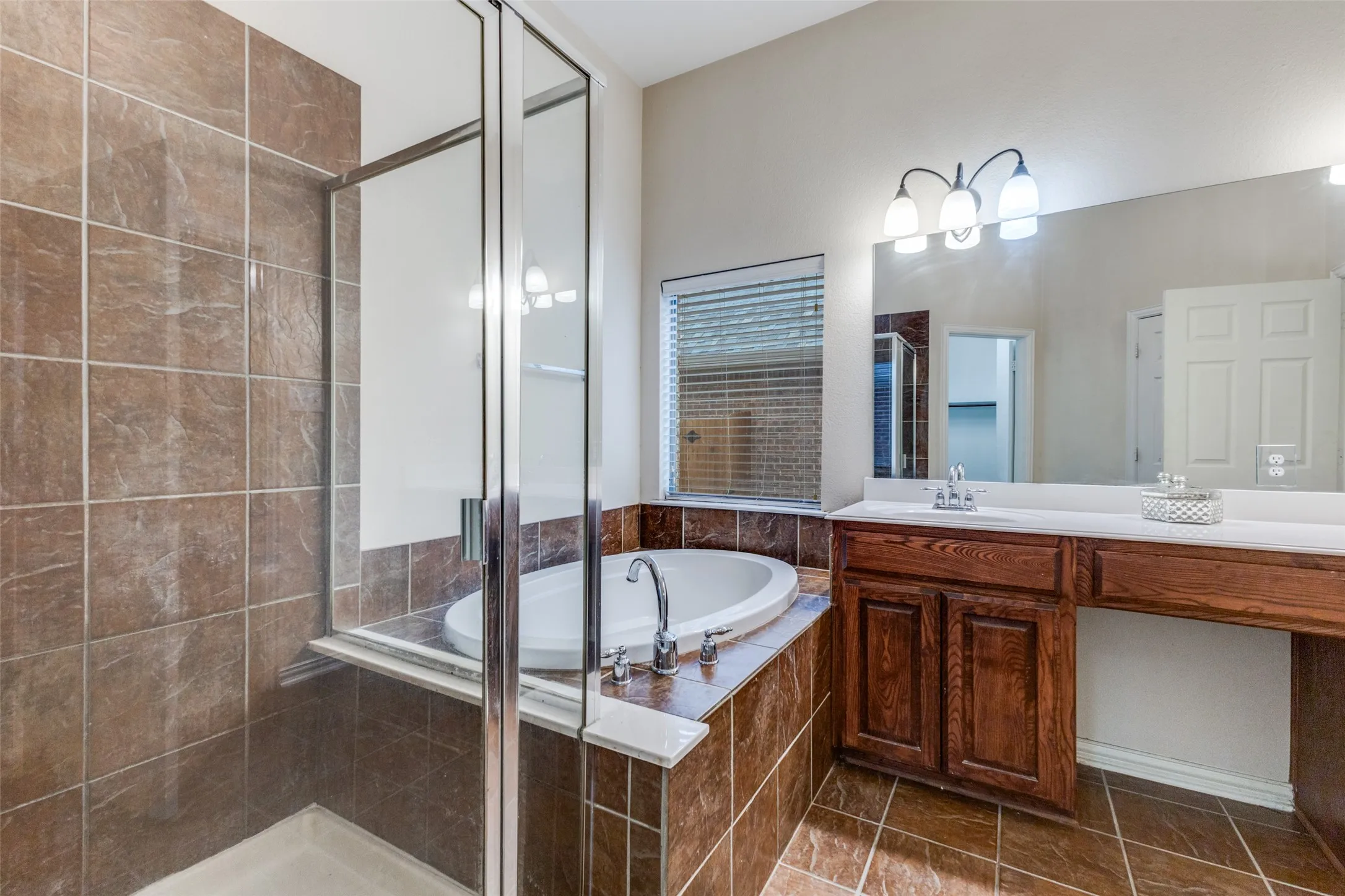 The ensuite bath enjoys a large shower, soaking tub, dual sinks and large walk in closet.