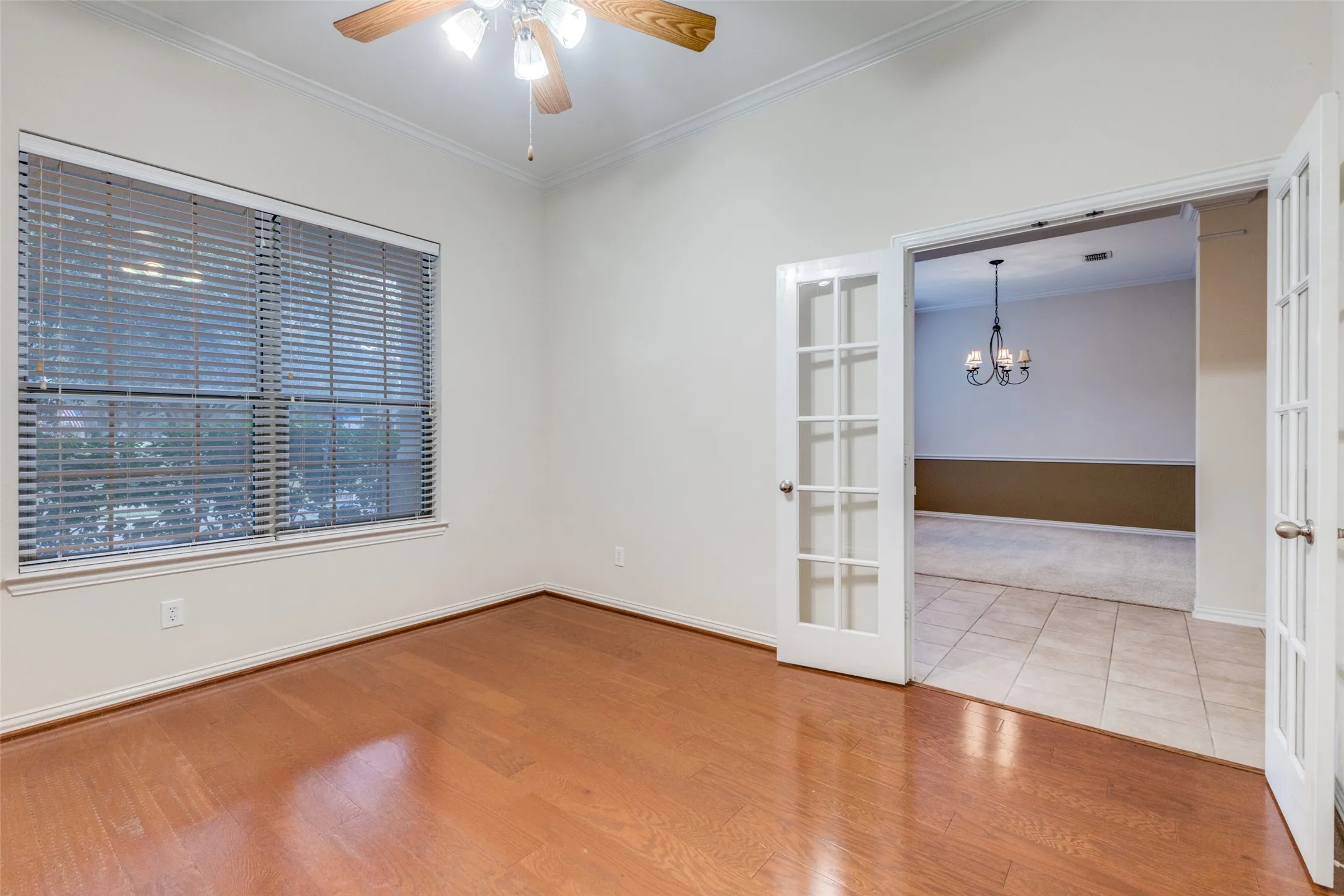 This space is light filled and features wood floors and French doors for privacy.  This would make a great study, exercise room or play room for a family.