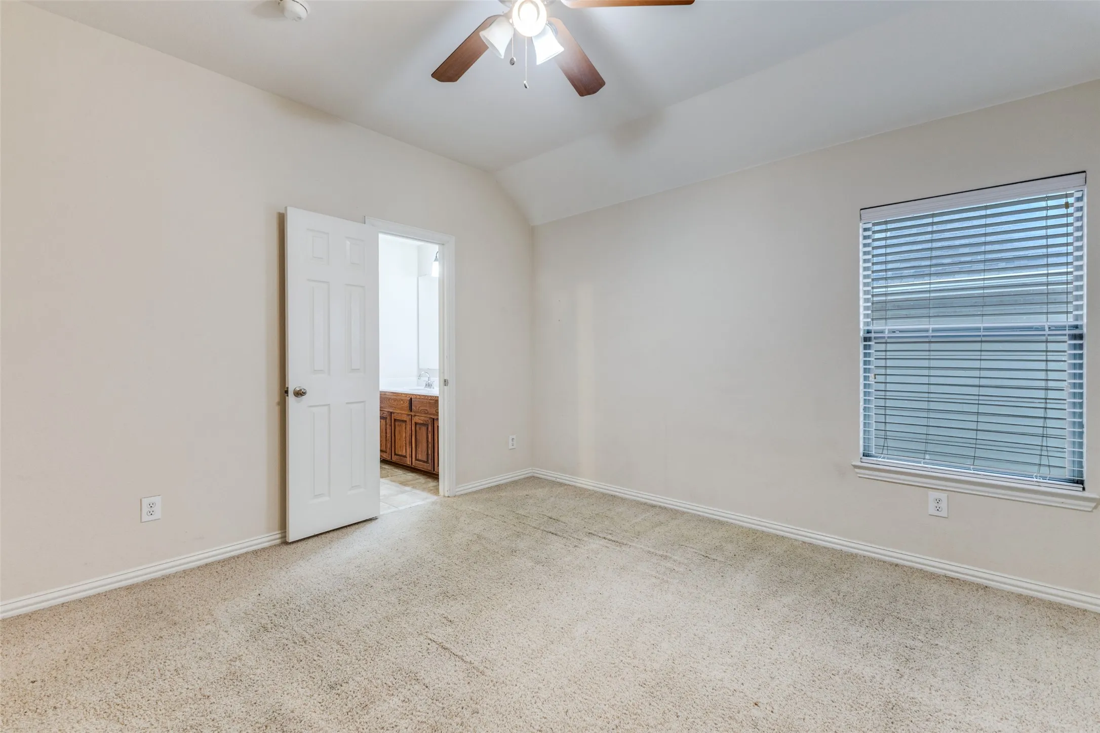 Upstairs guest room with adjacent bath.