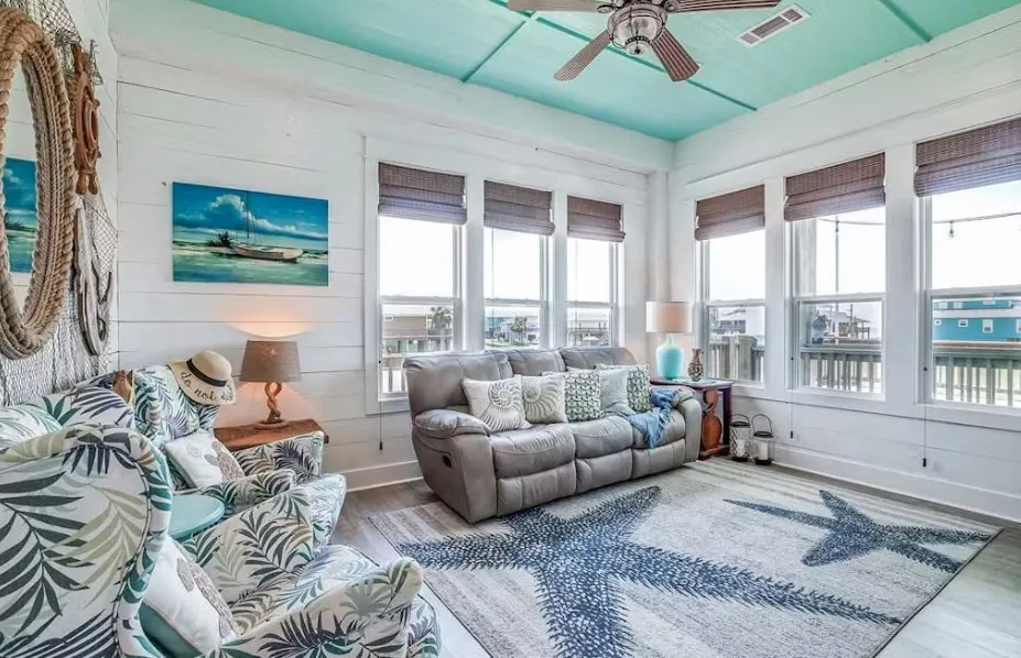 Sunroom featuring wood finished floors and wooden walls