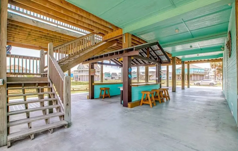 View of patio featuring stairway and a deck