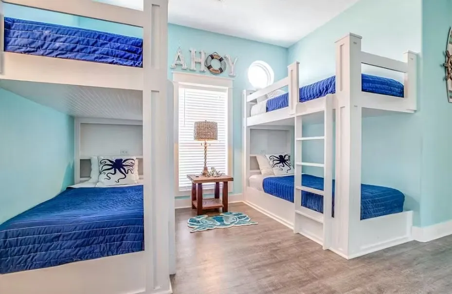 Bedroom featuring wood finished floors and baseboards