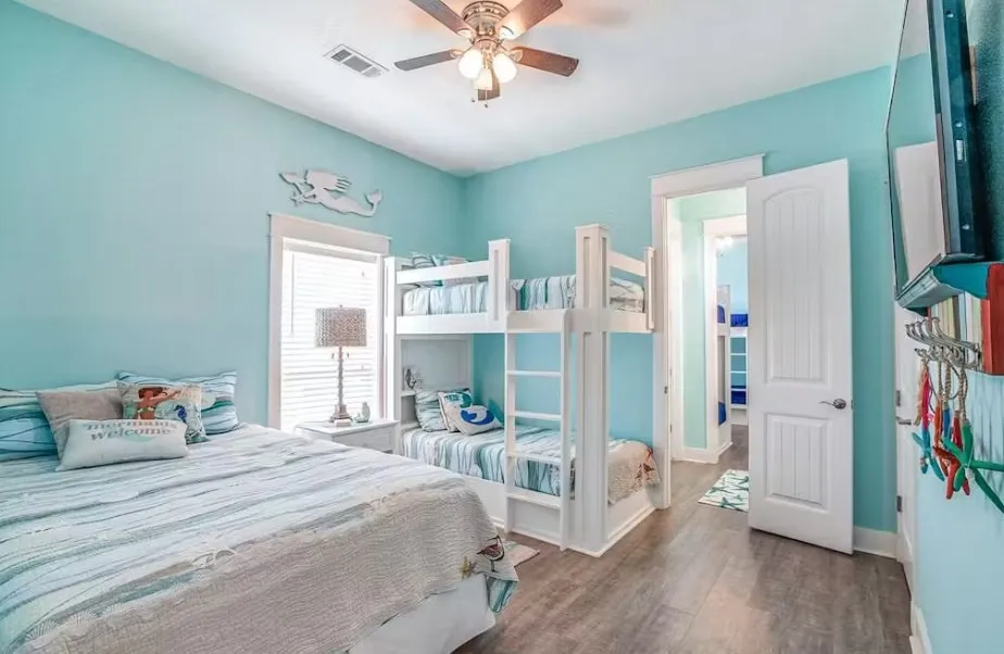 Bedroom with dark wood-style flooring and ceiling fan
