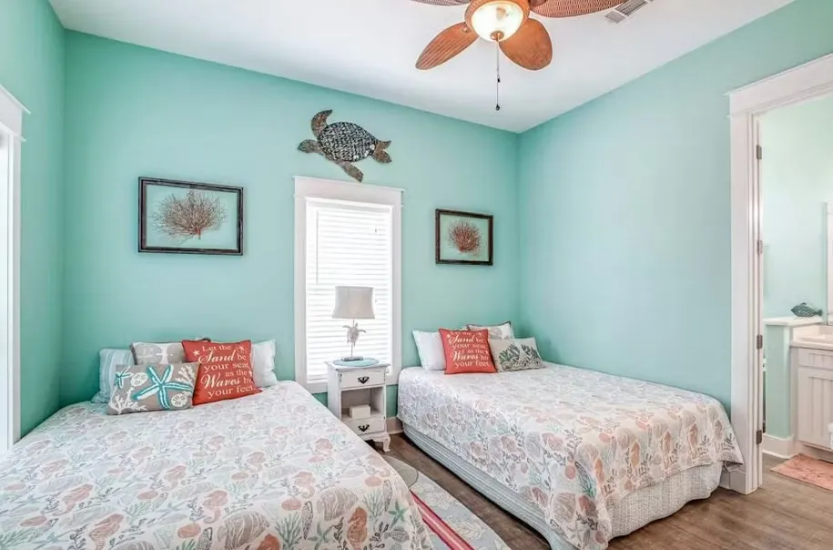 Bedroom with a ceiling fan and wood finished floors