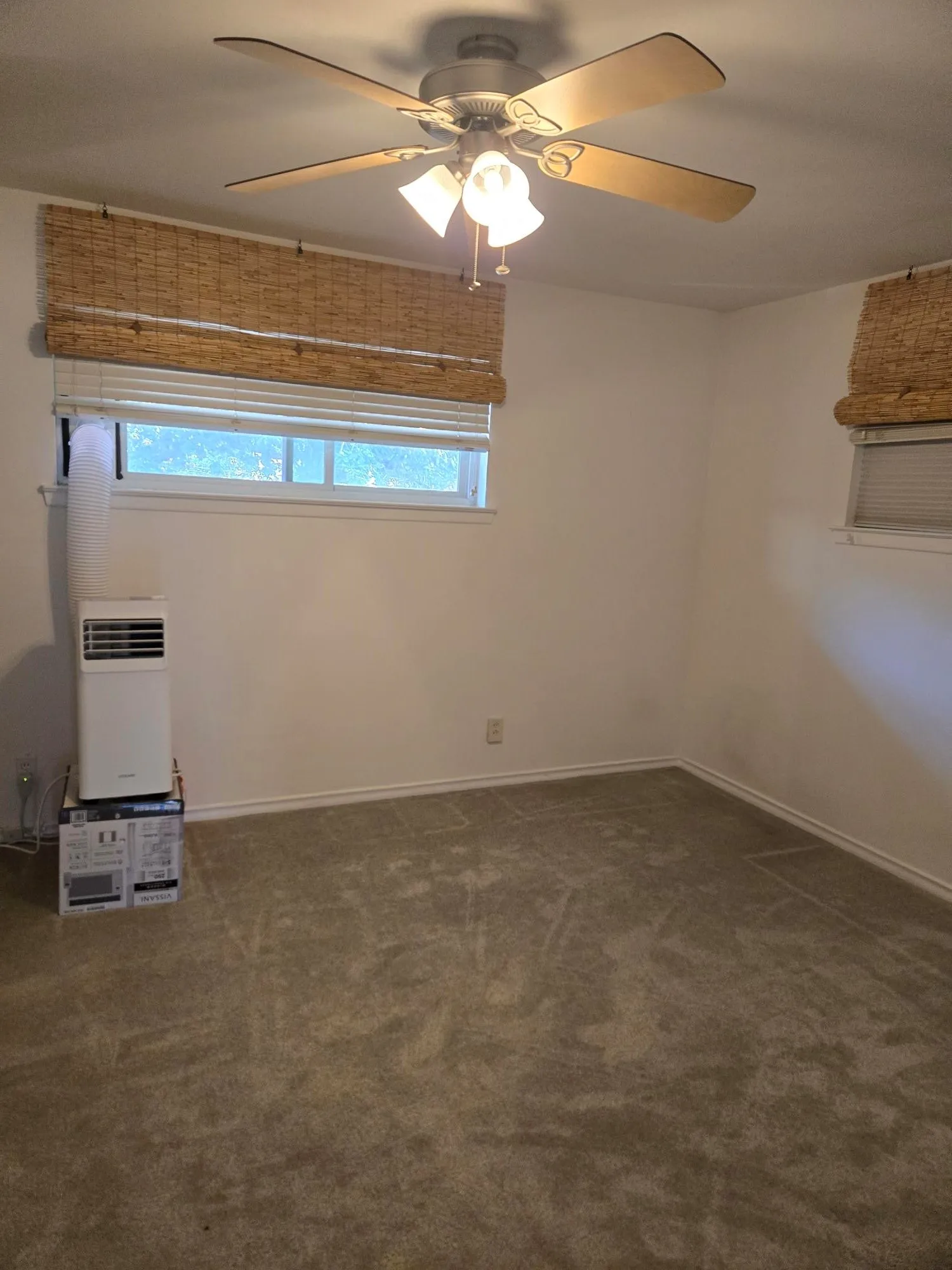 Recessed window with woven wood shades