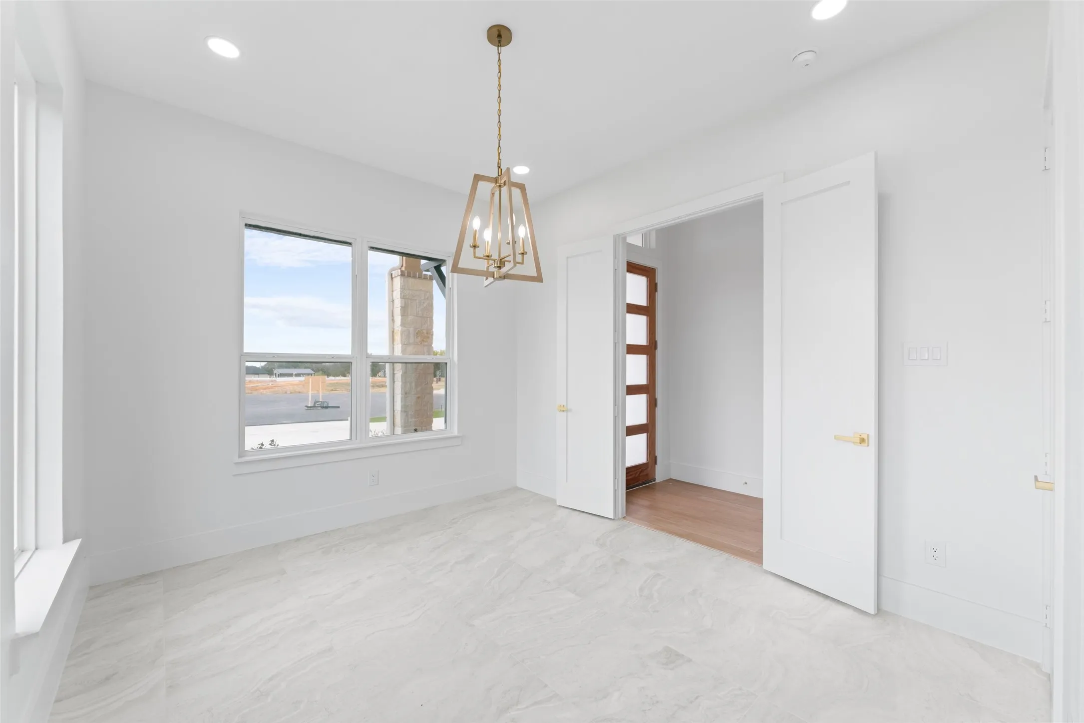 Unfurnished dining area with a chandelier and recessed lighting