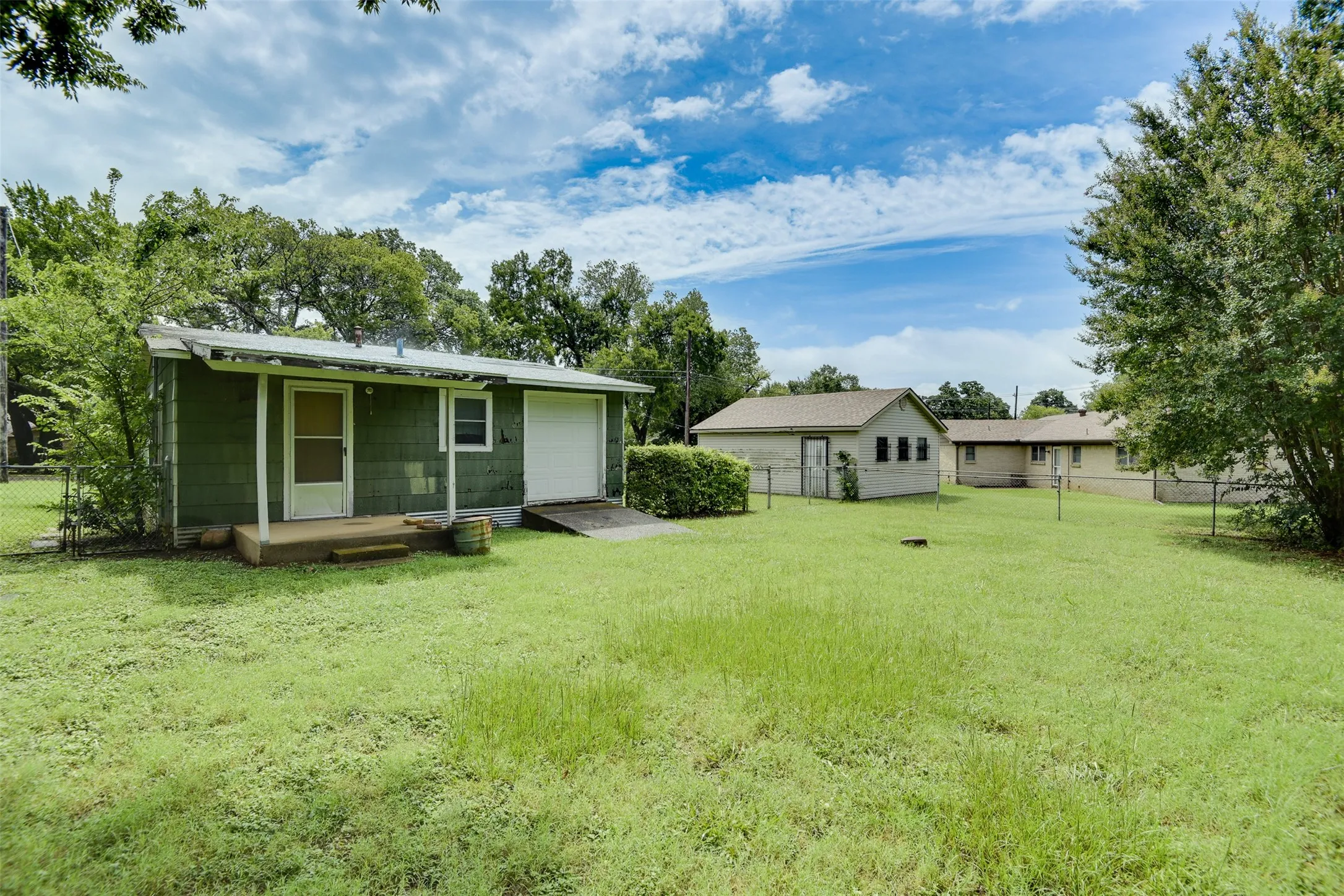 Rear view of house with a garage