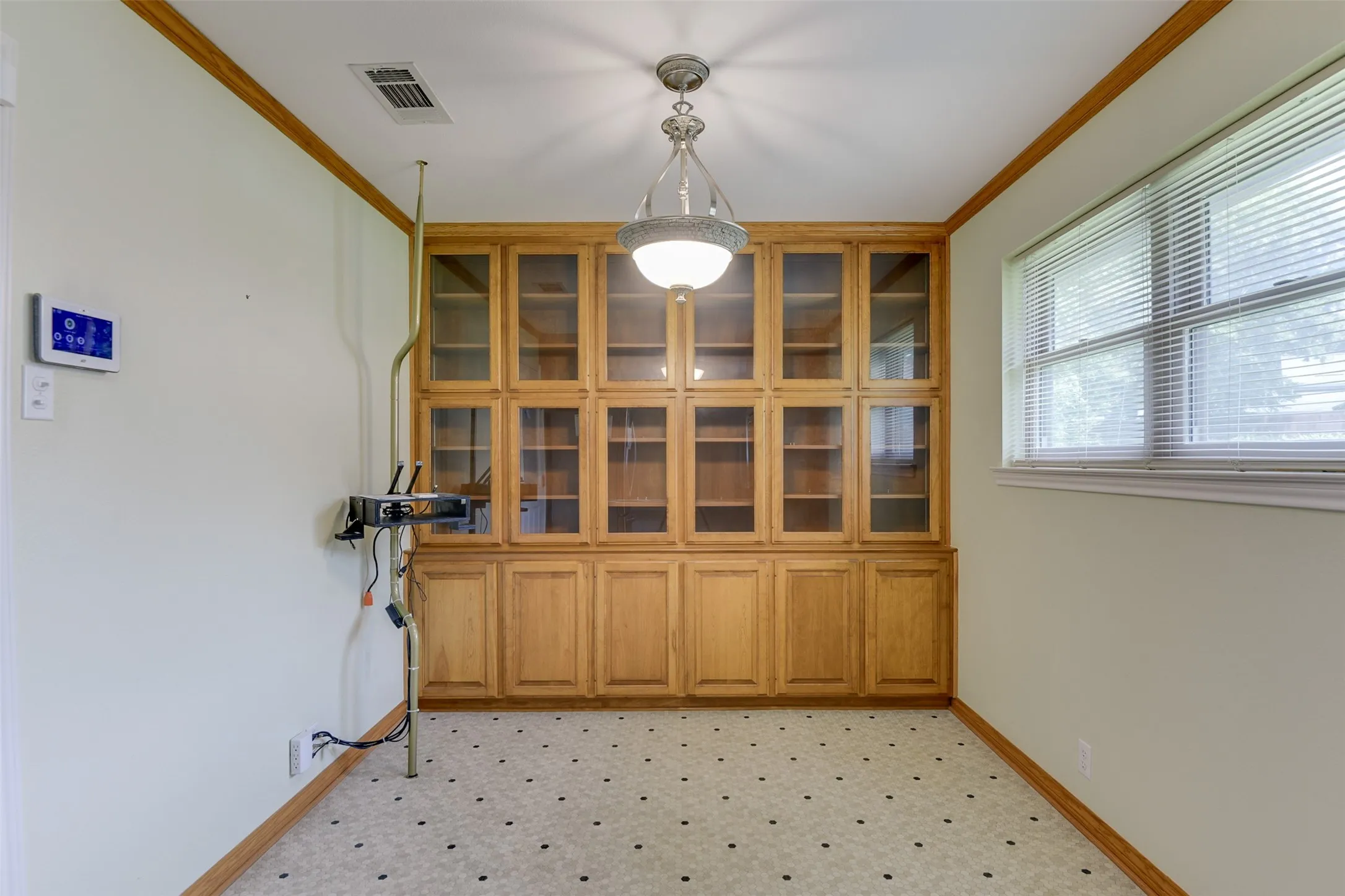Unfurnished dining area featuring ornamental molding