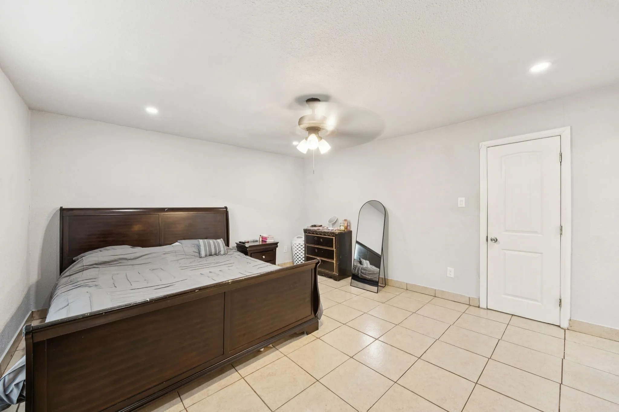 Bedroom featuring recessed lighting, a ceiling fan, and light tile patterned floors
