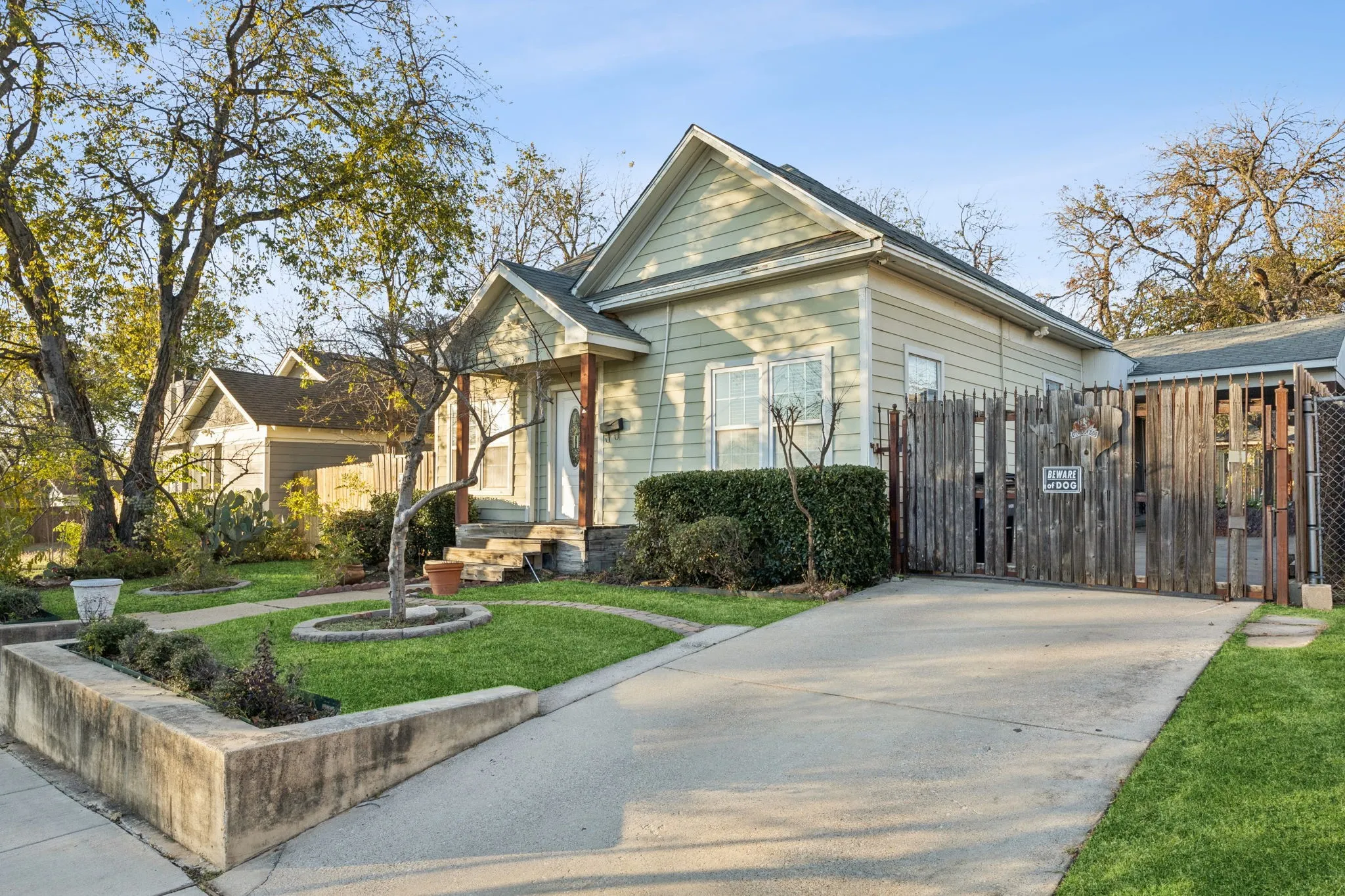 View of front of property featuring a gate