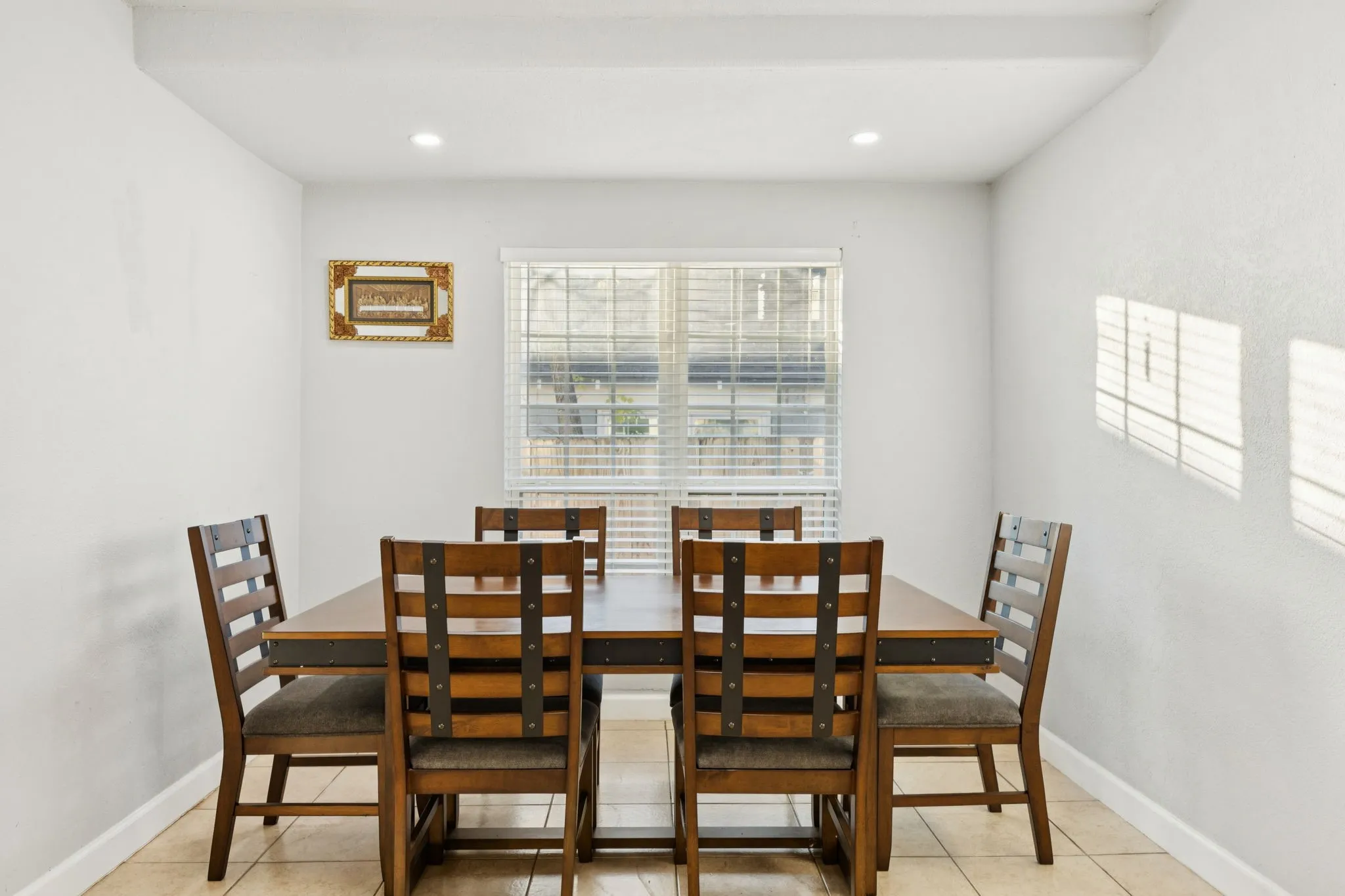 Dining space featuring recessed lighting and light tile patterned floors