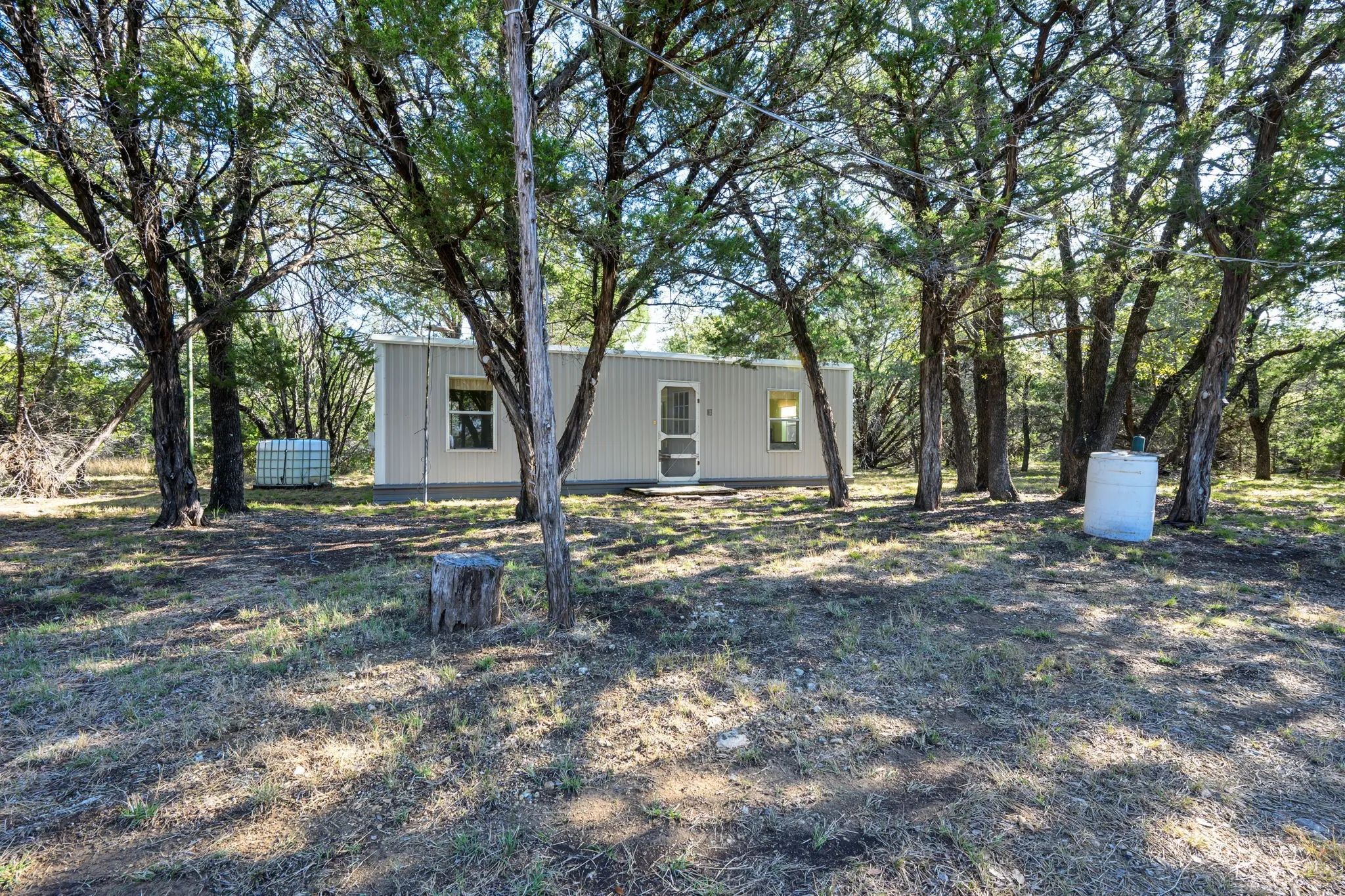 View of yard with view of wooded area