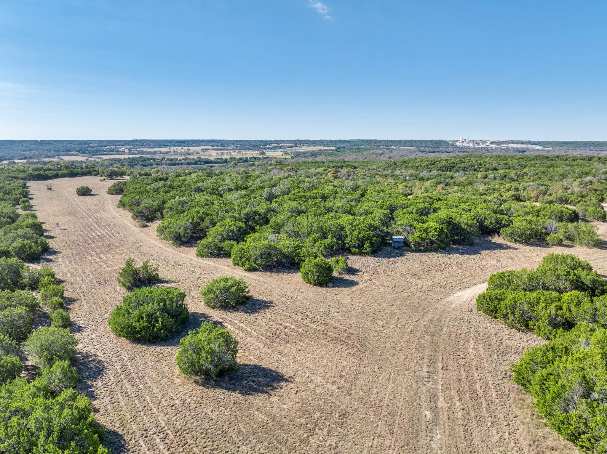 Aerial view of sparsely populated area featuring extensive farmland
