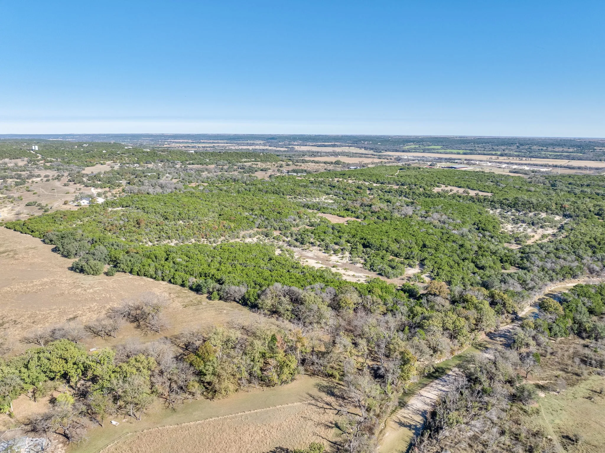 Drone / aerial view of a heavily wooded area
