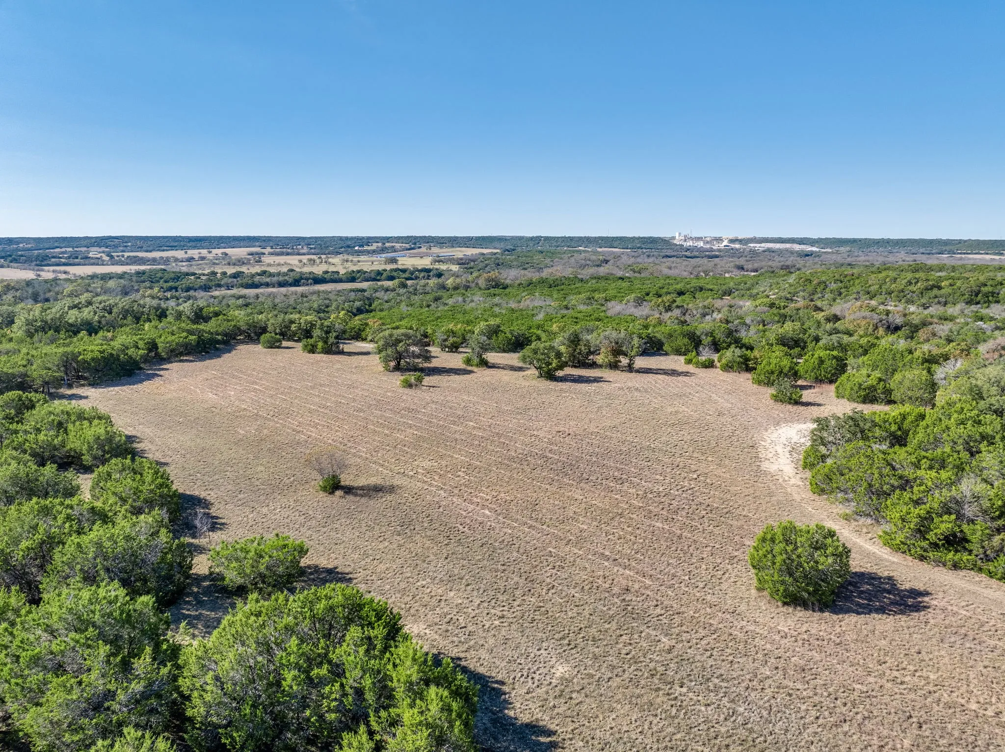 Aerial view of sparsely populated area featuring abundant farmland