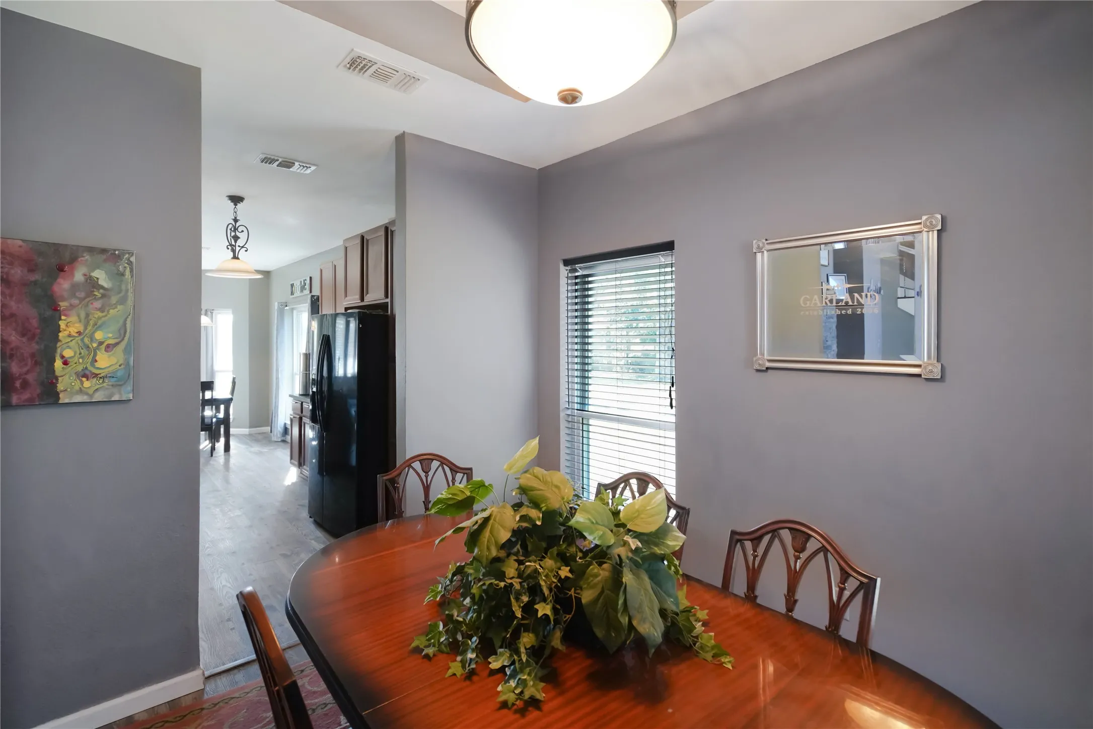 Dining space featuring wood finished floors and baseboards