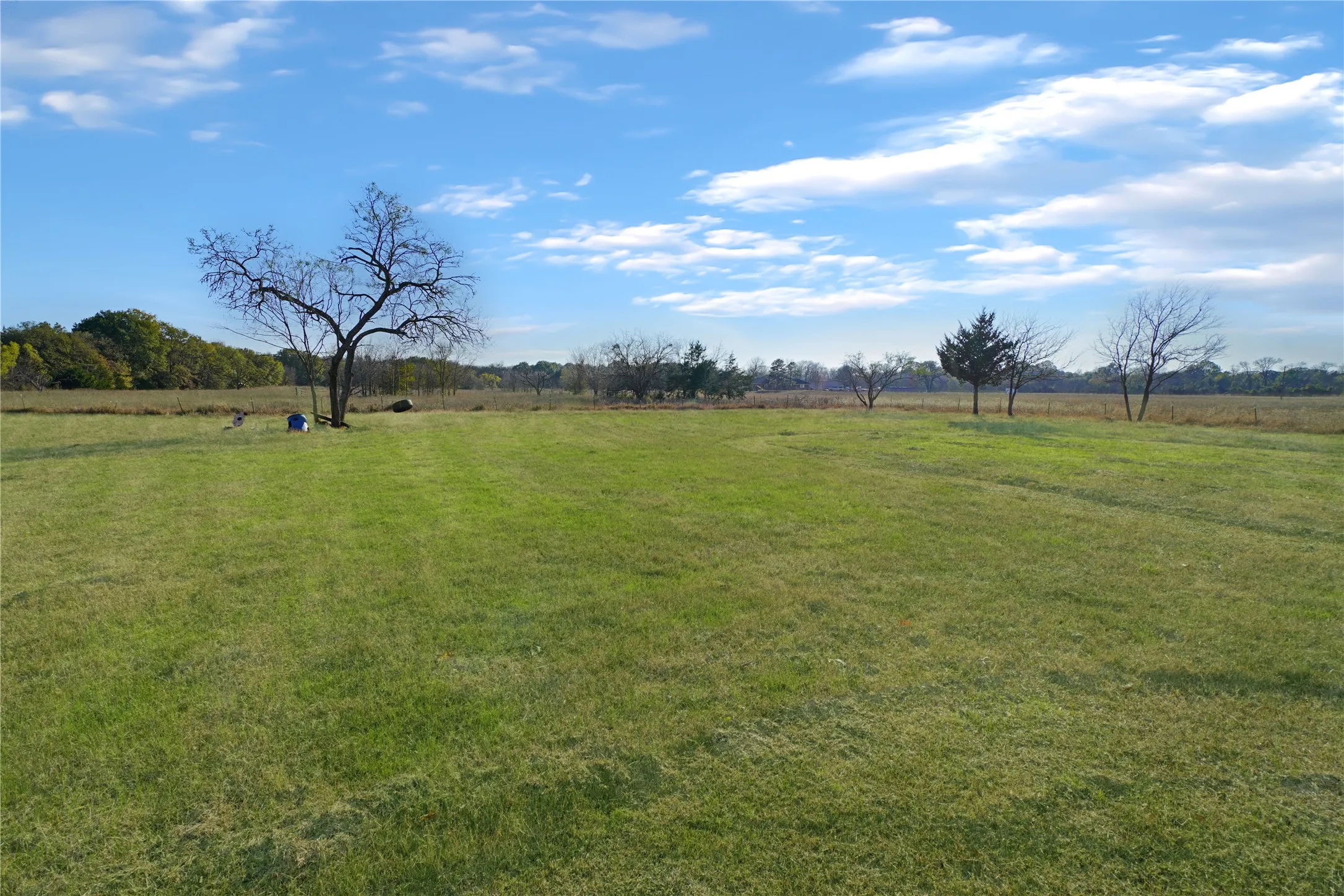 View of green lawn featuring a rural view