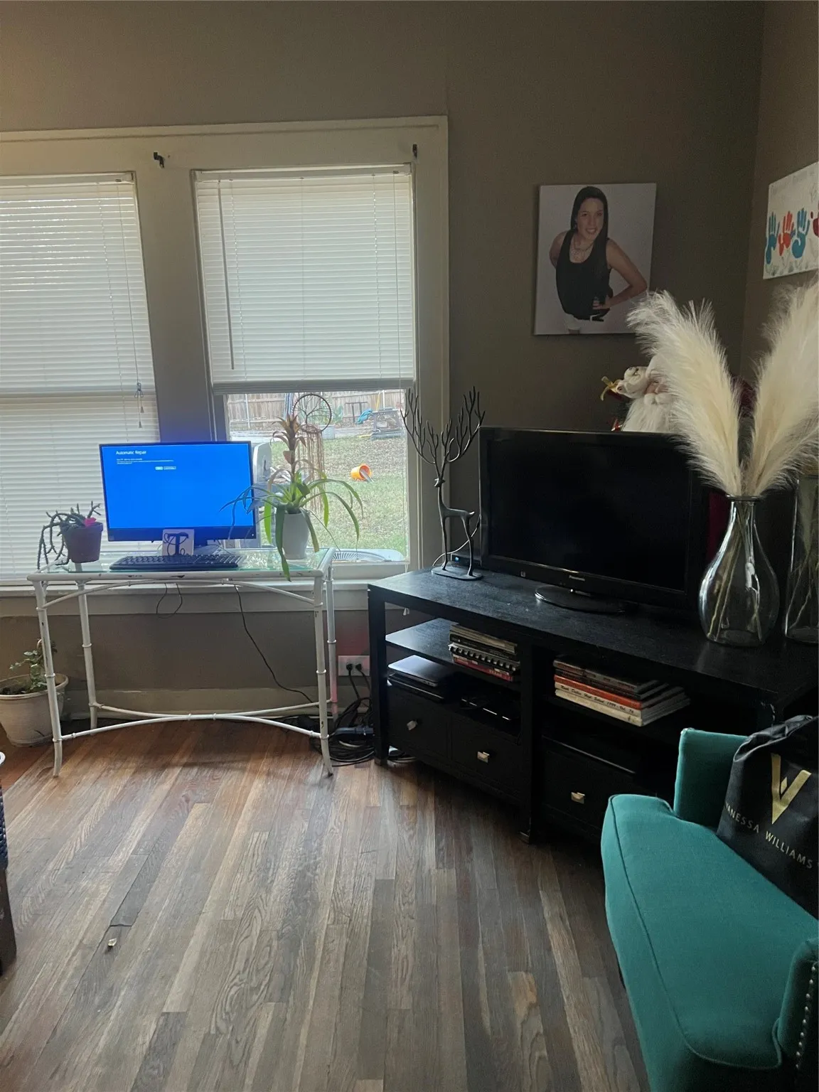 Office area featuring dark wood-style floors