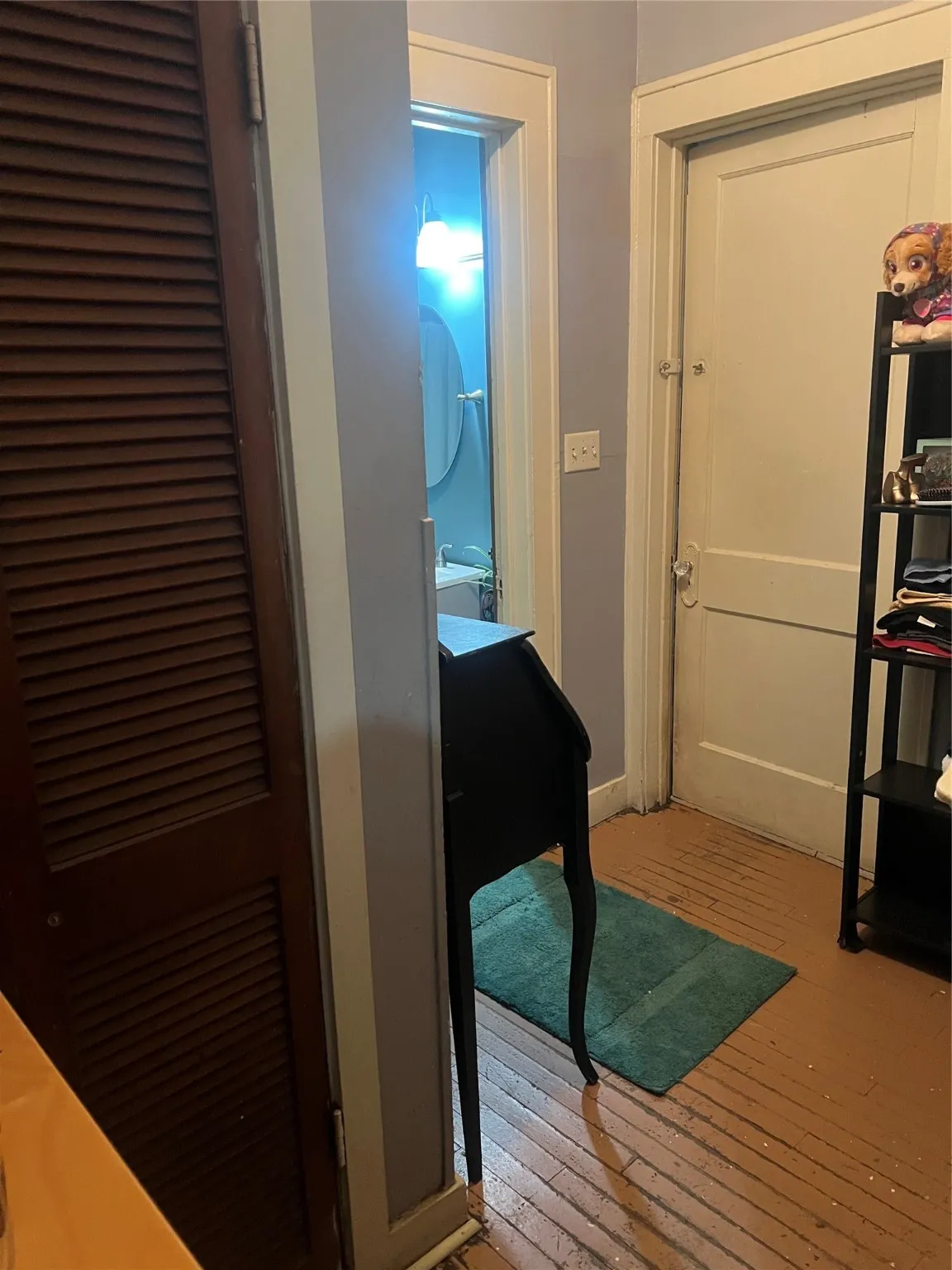 Hall featuring light wood finished floors