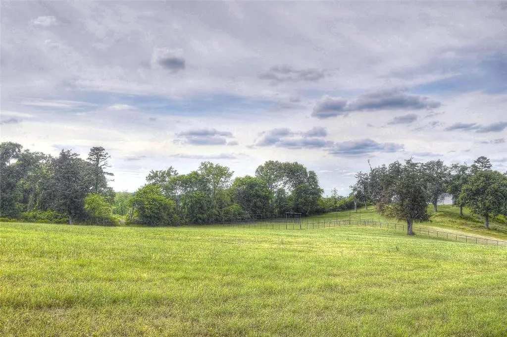 View of green lawn with a view of countryside