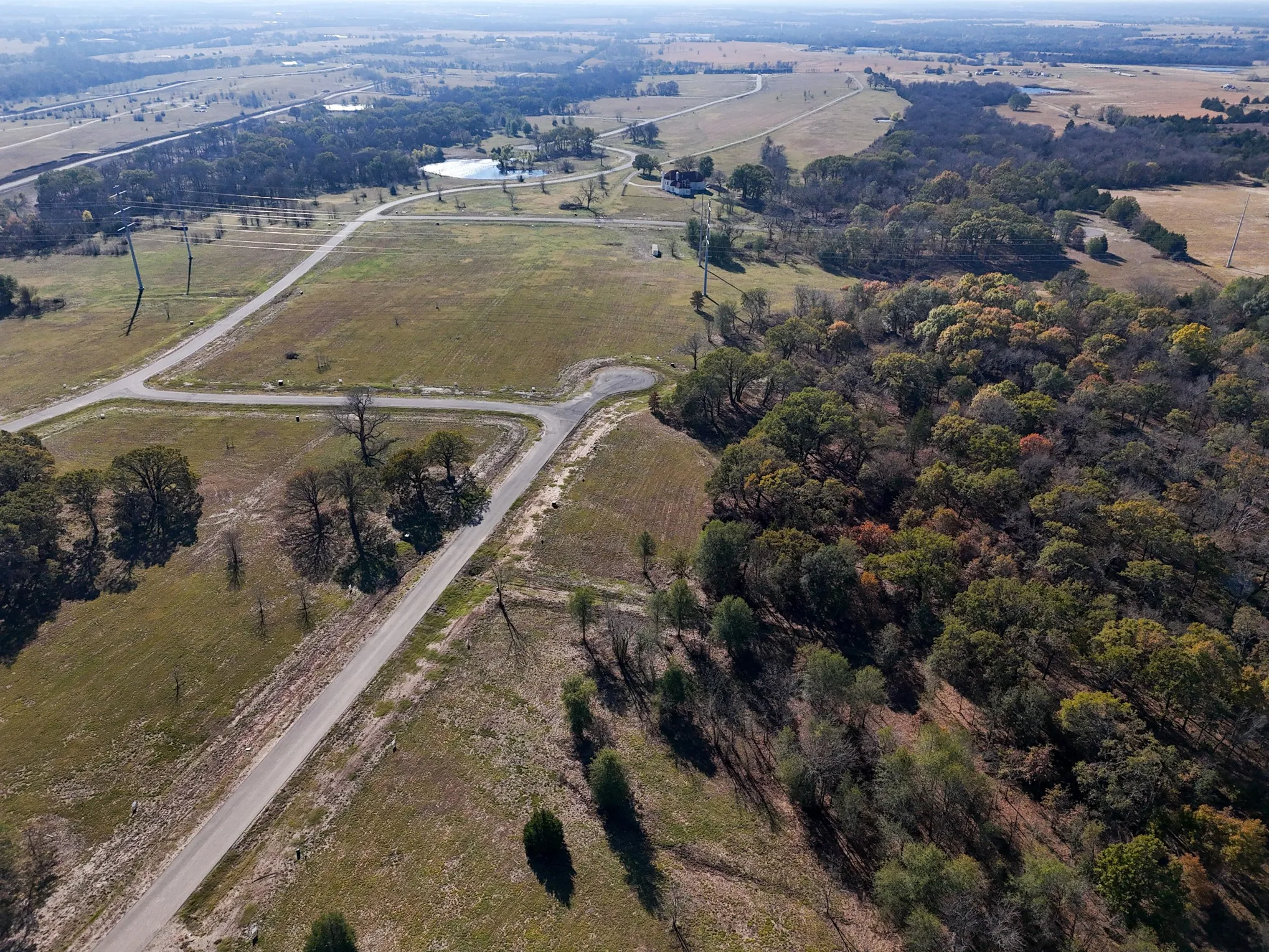 Aerial view of property and surrounding area with rural landscape