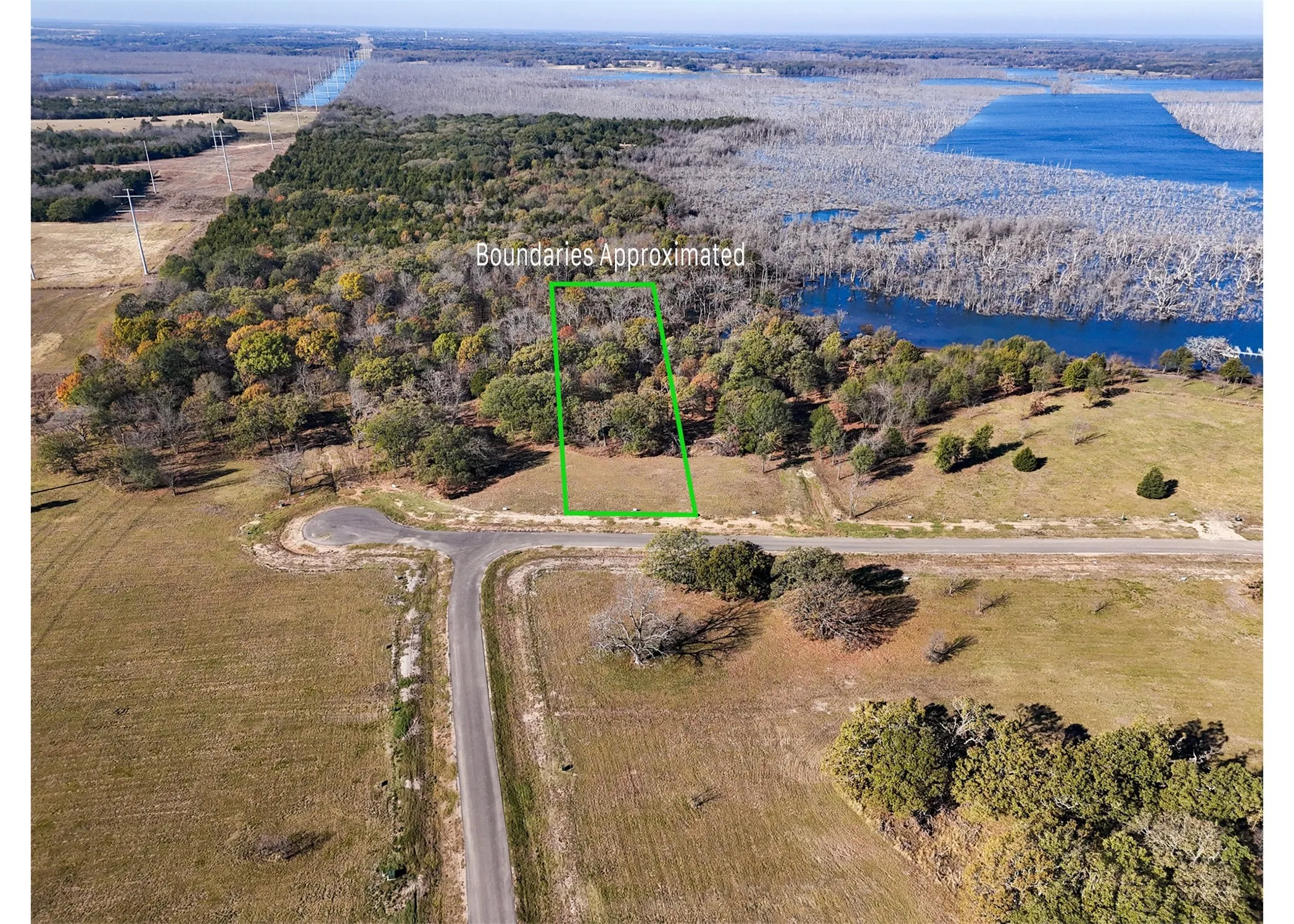 View of property location with property boundaries highlighted and a heavily wooded area