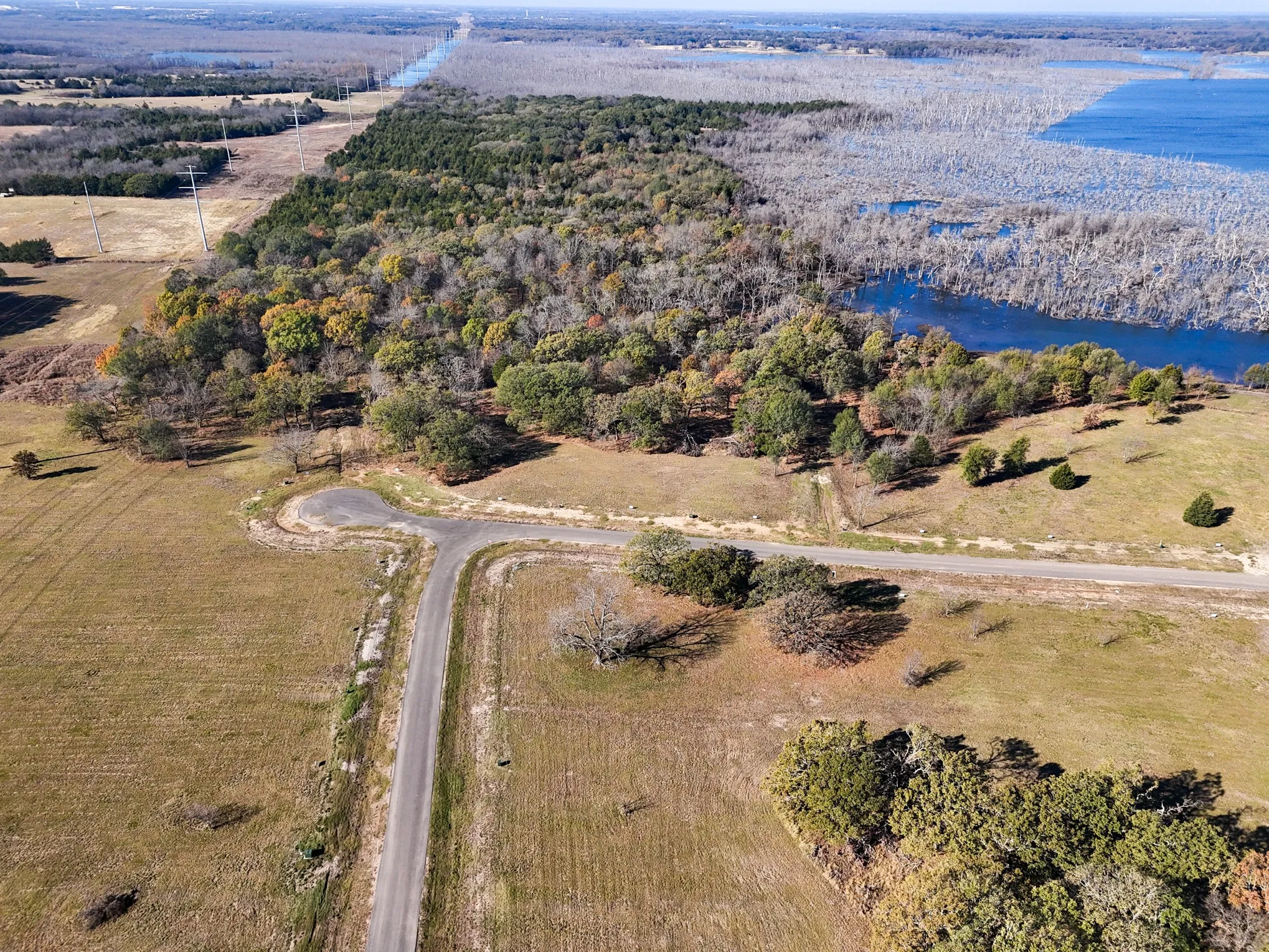 View of property location featuring a heavily wooded area