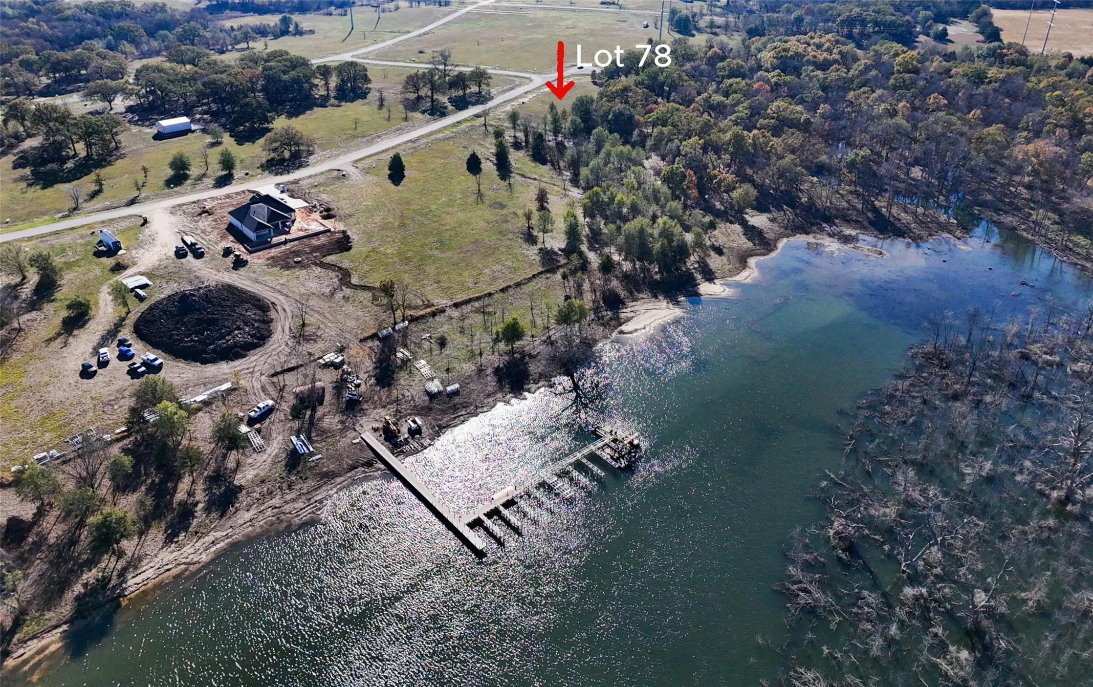 Aerial view of property's location with a nearby body of water