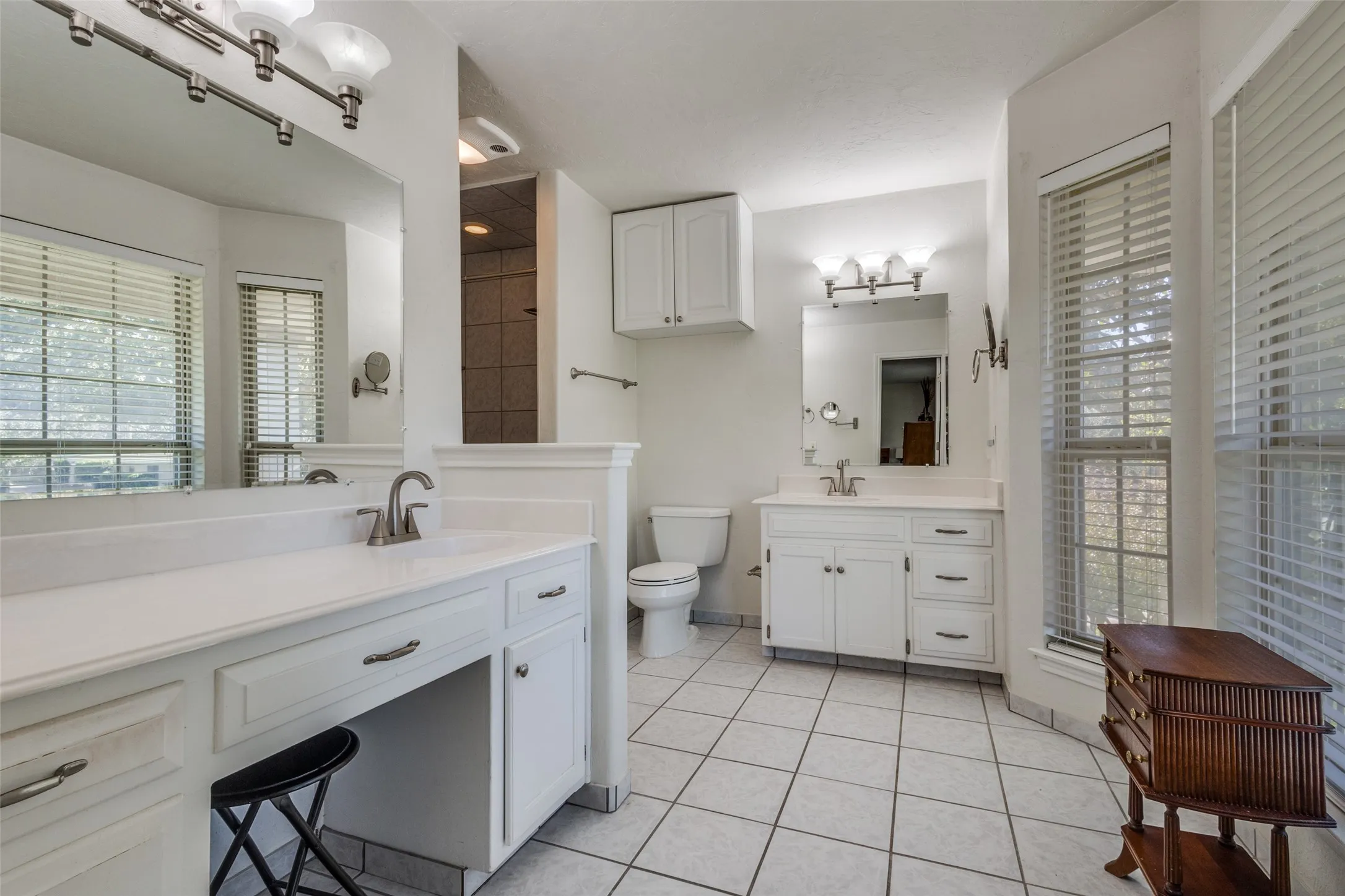 Primary bath with dual sinks a Jacuzzi tub with shower make this a great place to start or end your day.