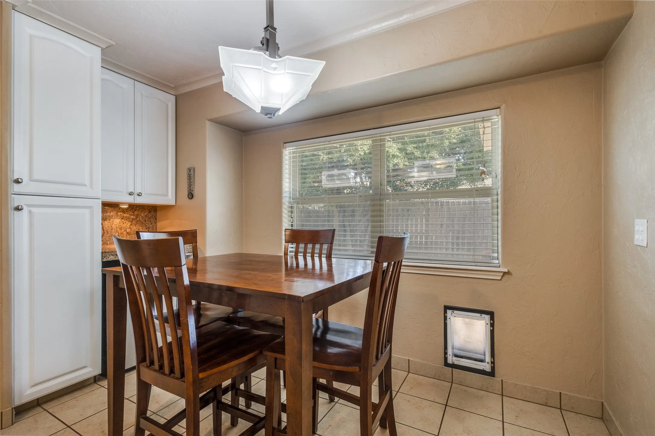 Nice eating area with a door for your fuzzy friend.