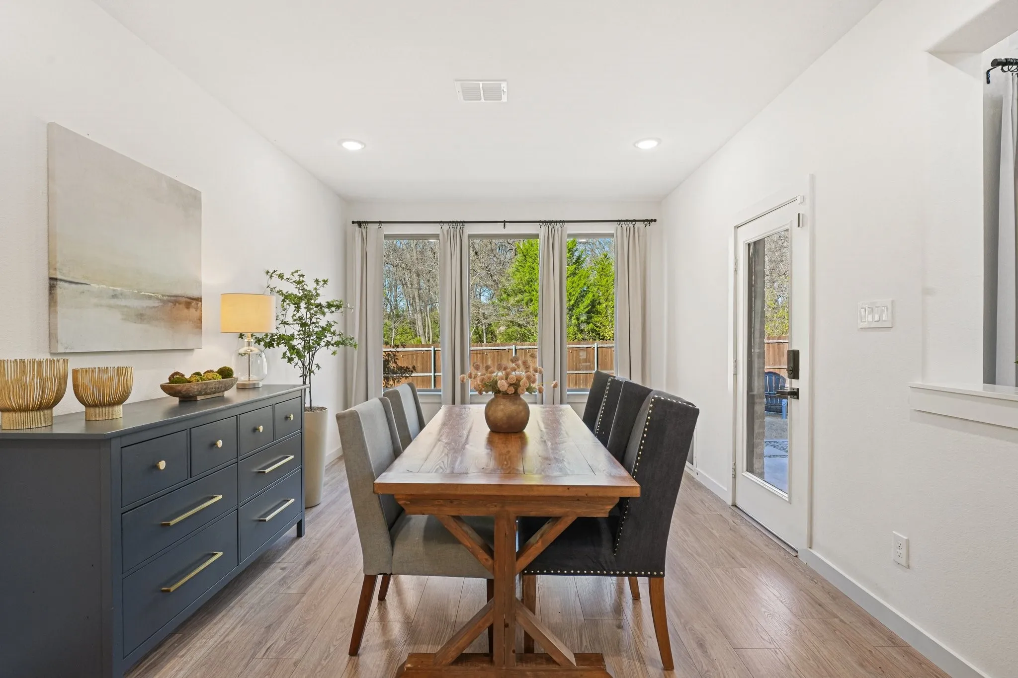 Dining room featuring plenty of natural light, light wood finished floors, and recessed lighting
