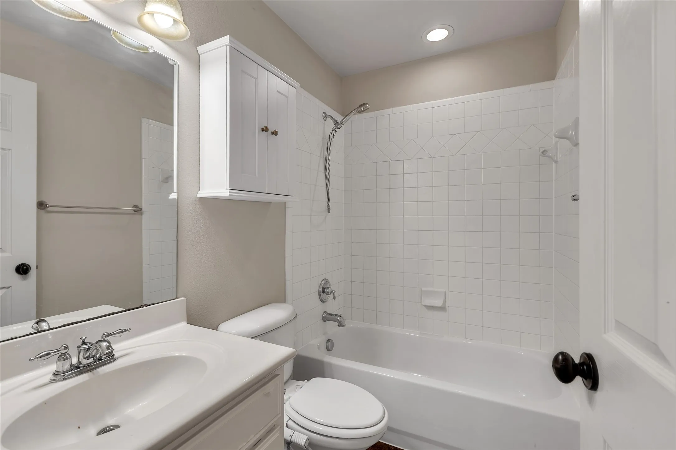 Bathroom featuring vanity and bathing tub / shower combination