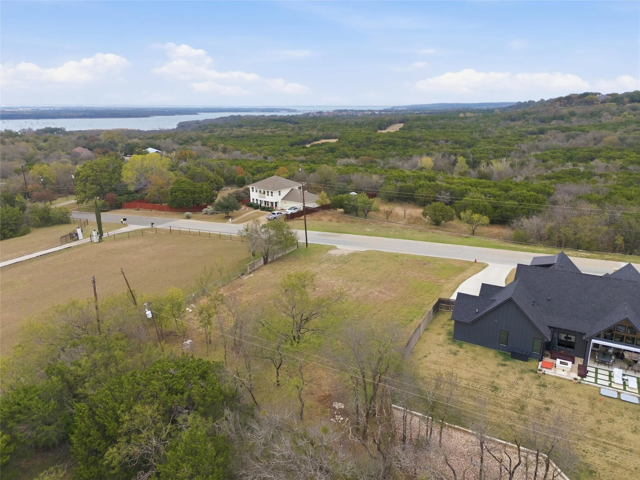 View of subject property with a forest