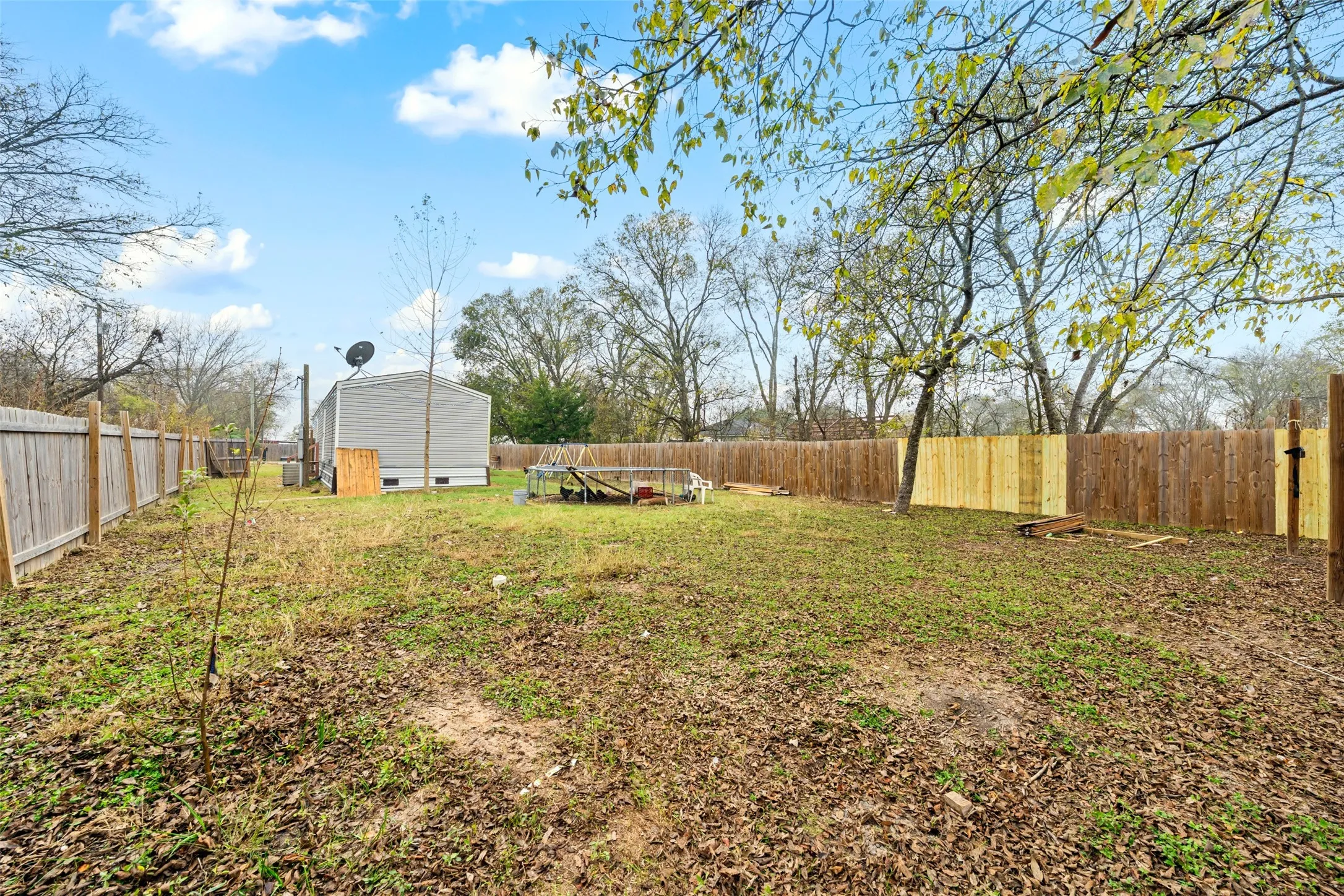 View of fenced backyard