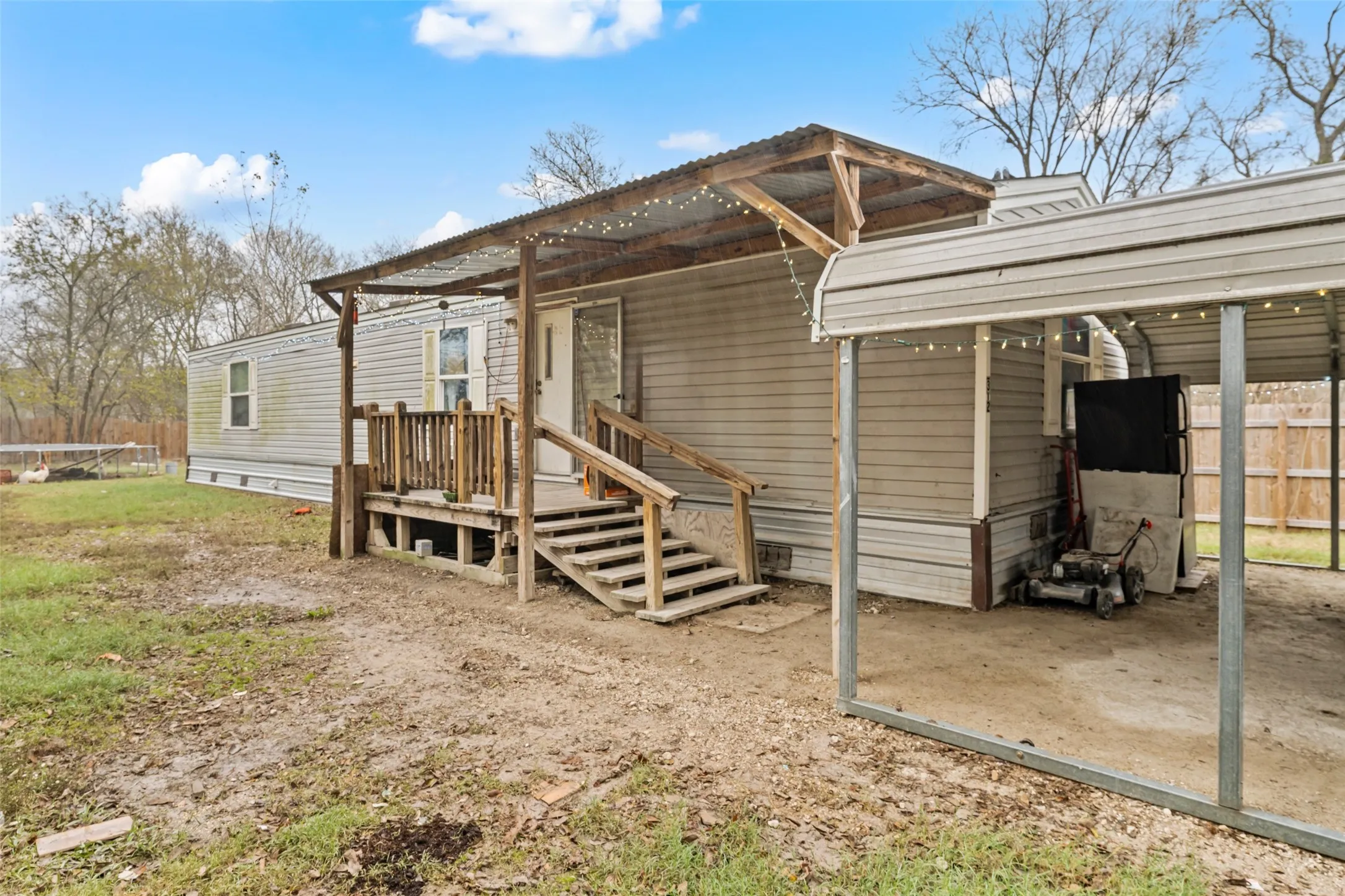 Back of house with a carport
