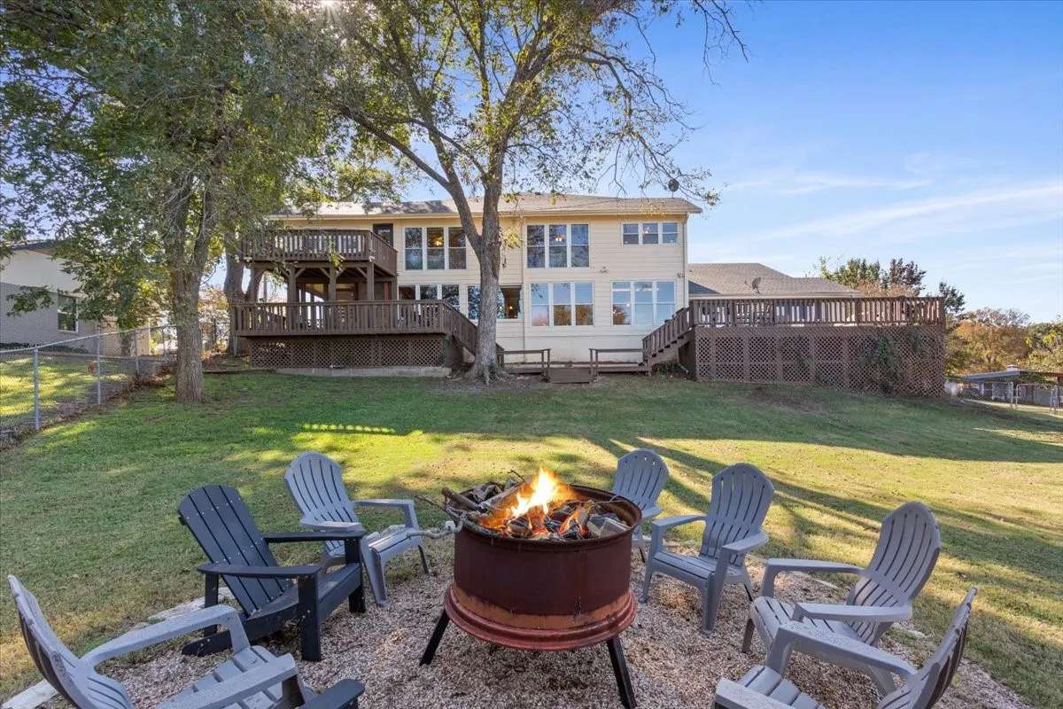 Rear view of property with a wooden deck and stairway