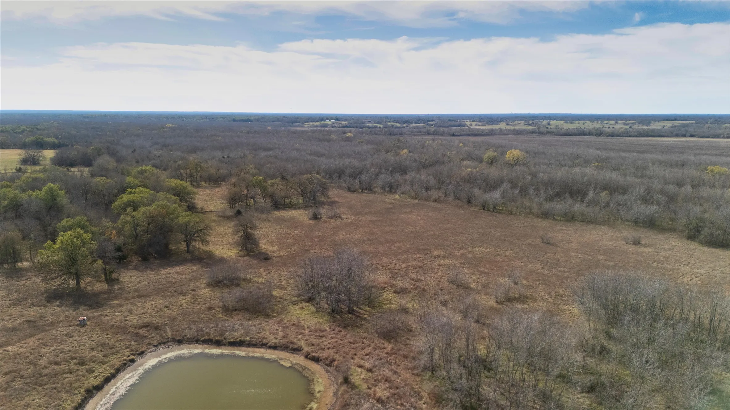 Aerial overview of property's location with a nearby body of water