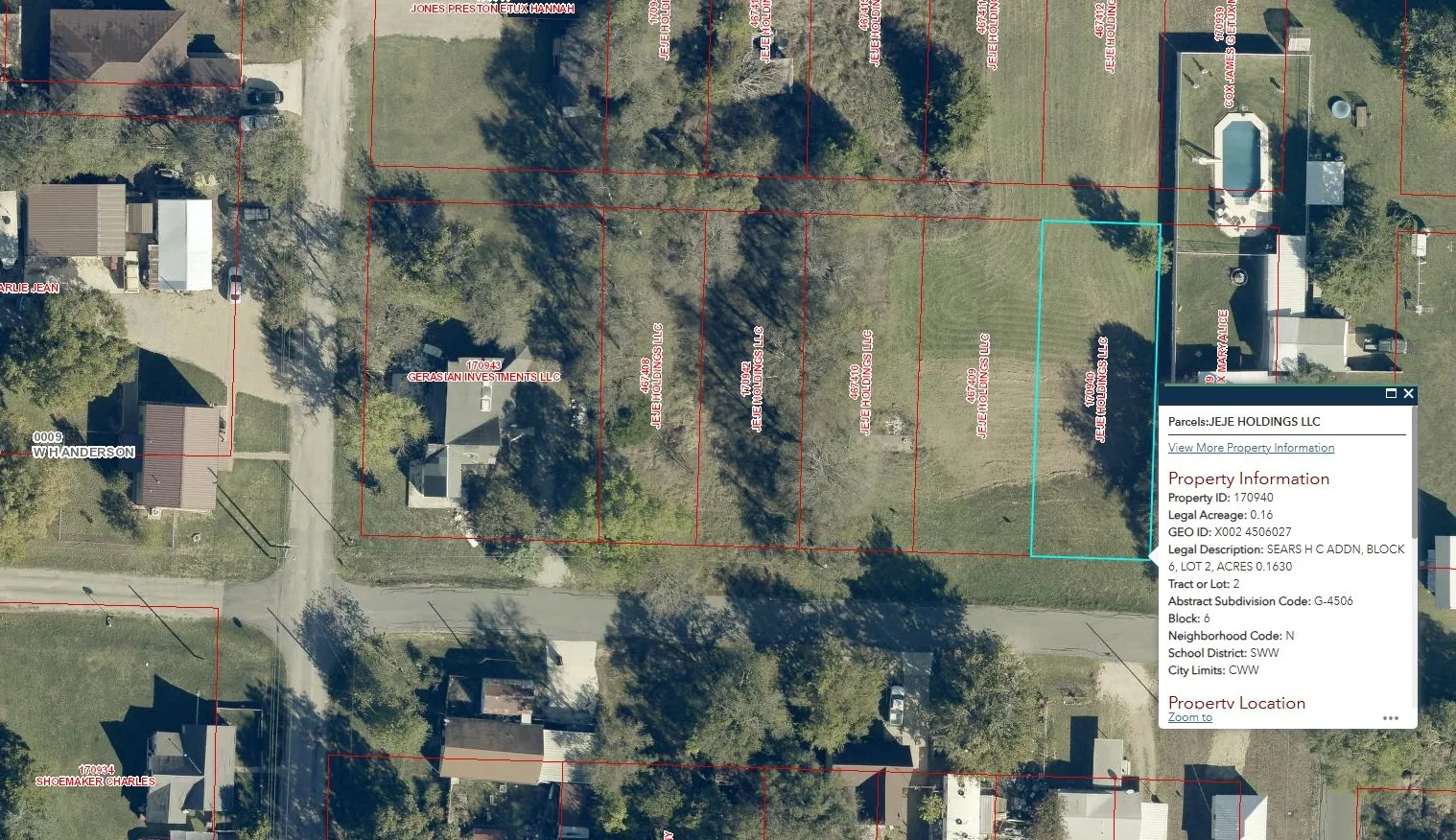 Aerial map of property and surrounding area with property boundaries highlighted