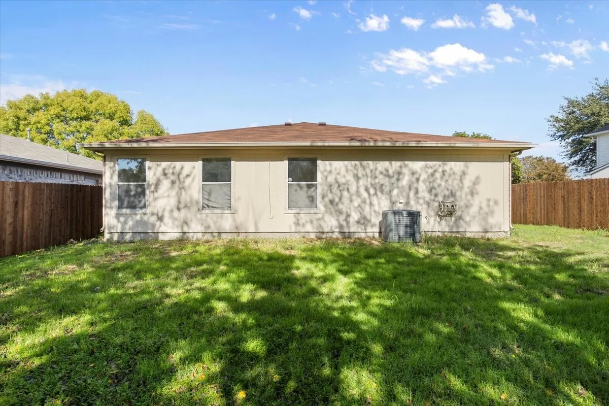 Back of house featuring a fenced backyard