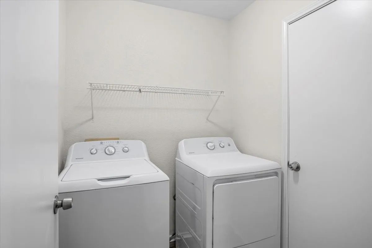 Washroom with washing machine and dryer