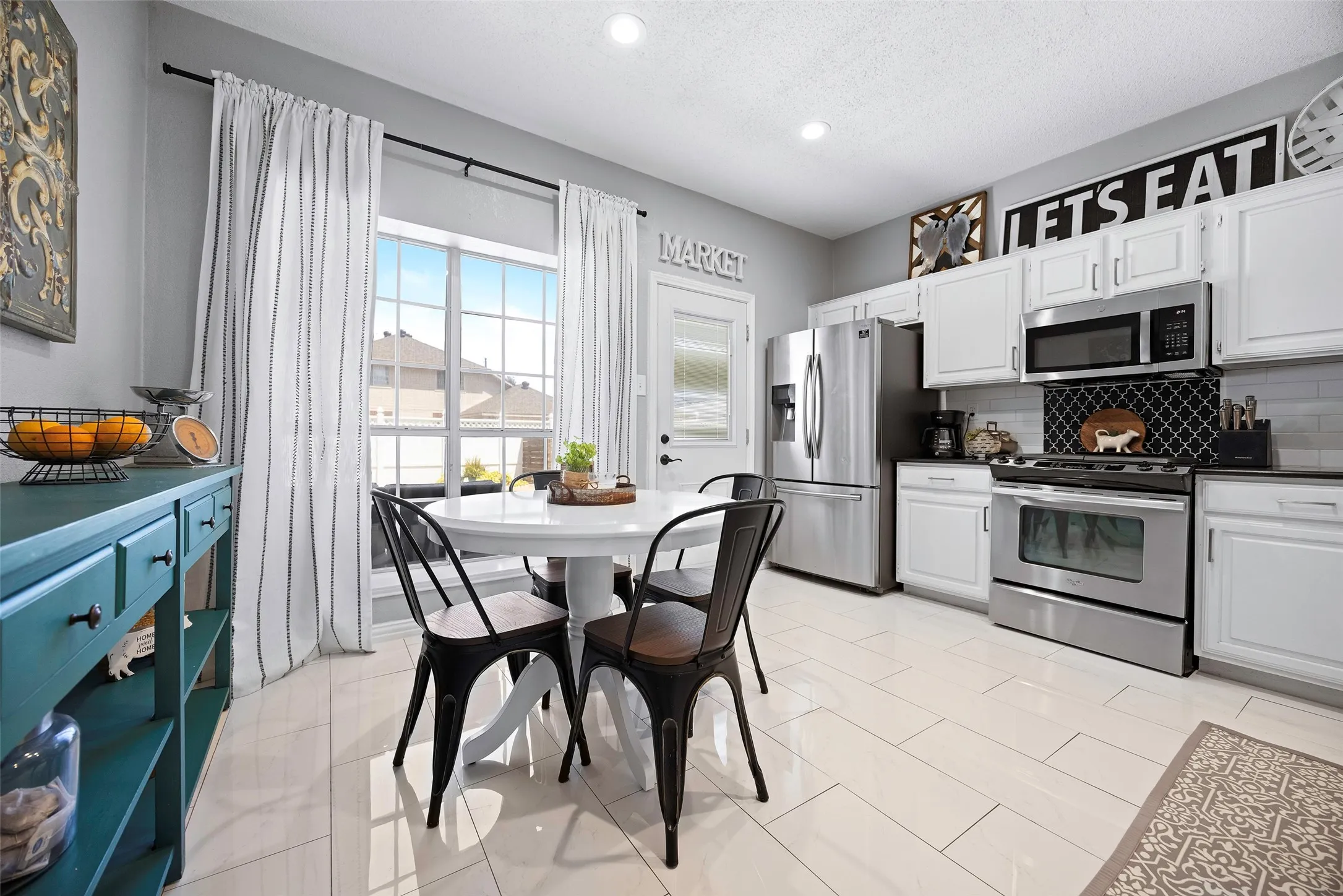 Another view of this great kitchen that overlooks the backyard oasis