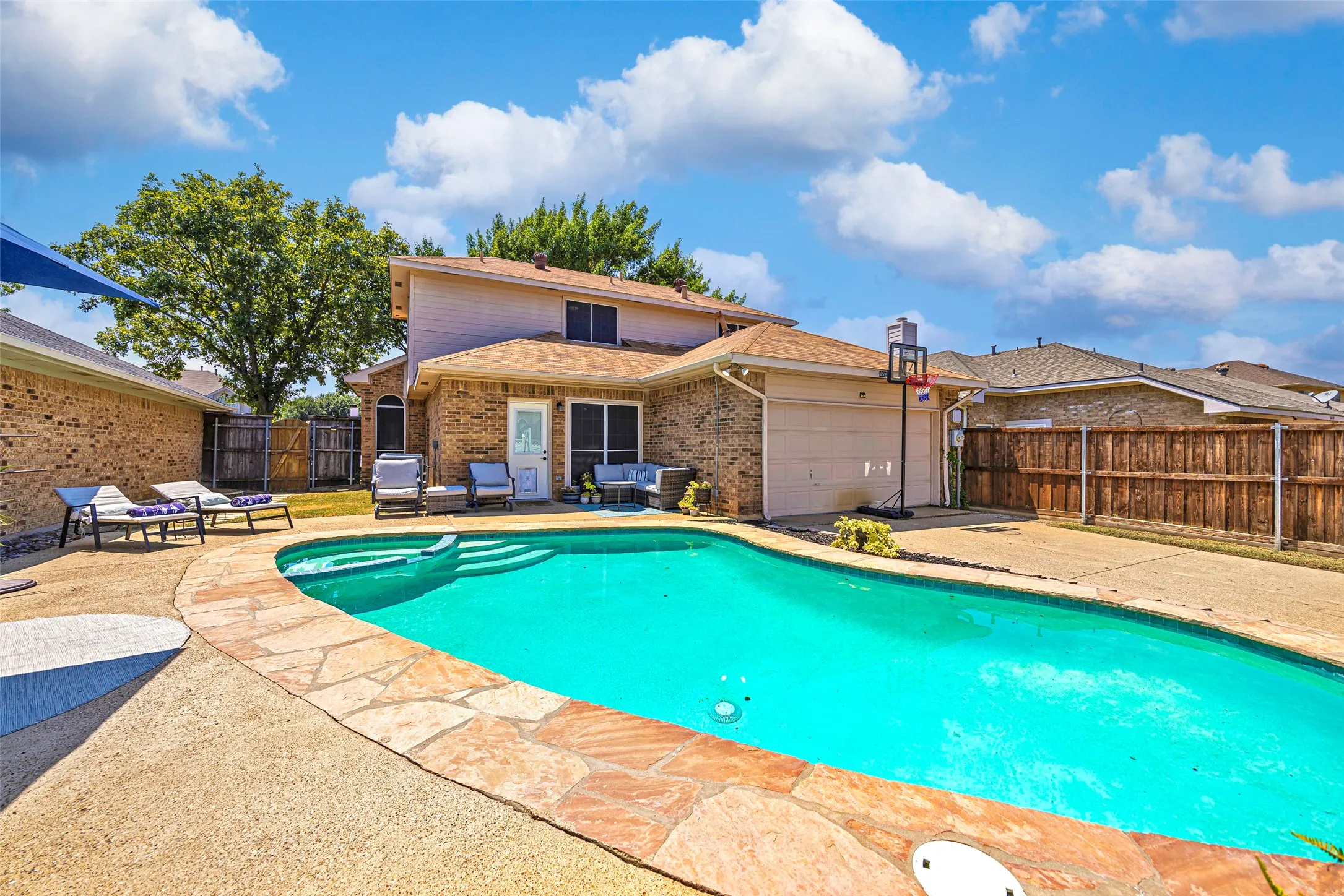 The enclosed driveway provides additional backyard space