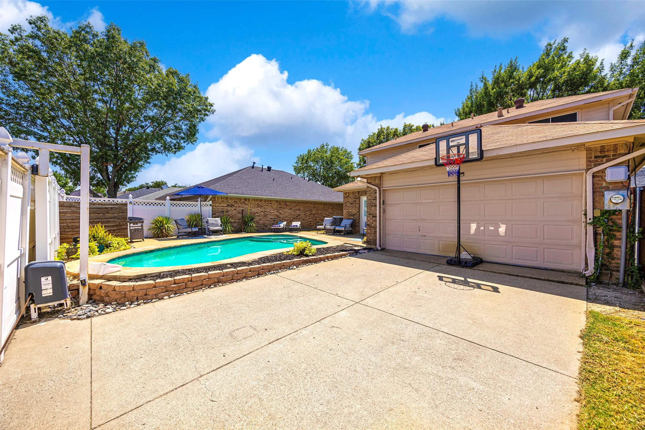Check out all of this extra backyard space with the enclosed driveway