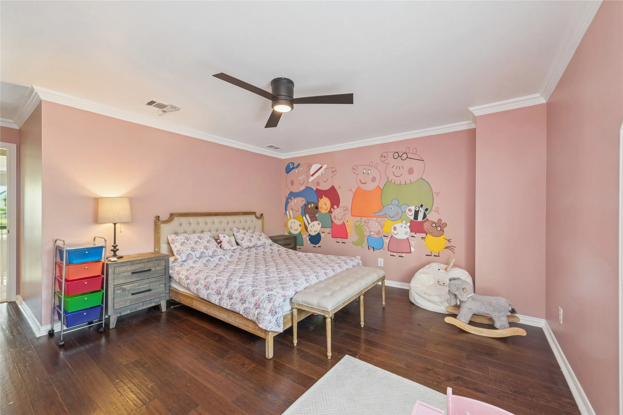 Bedroom with crown molding, dark wood-style floors, and ceiling fan