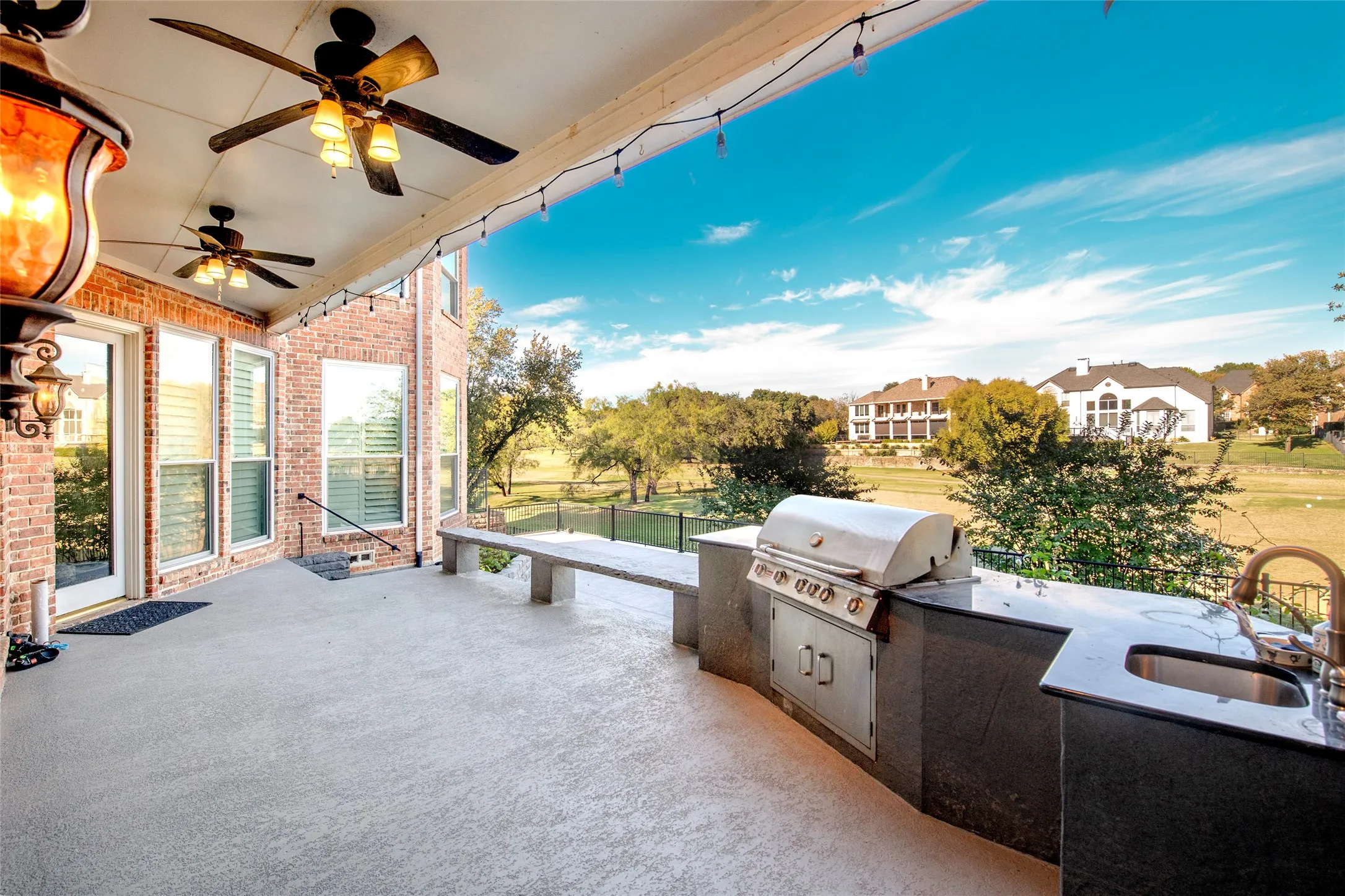 View of patio / terrace with exterior kitchen and a ceiling fan