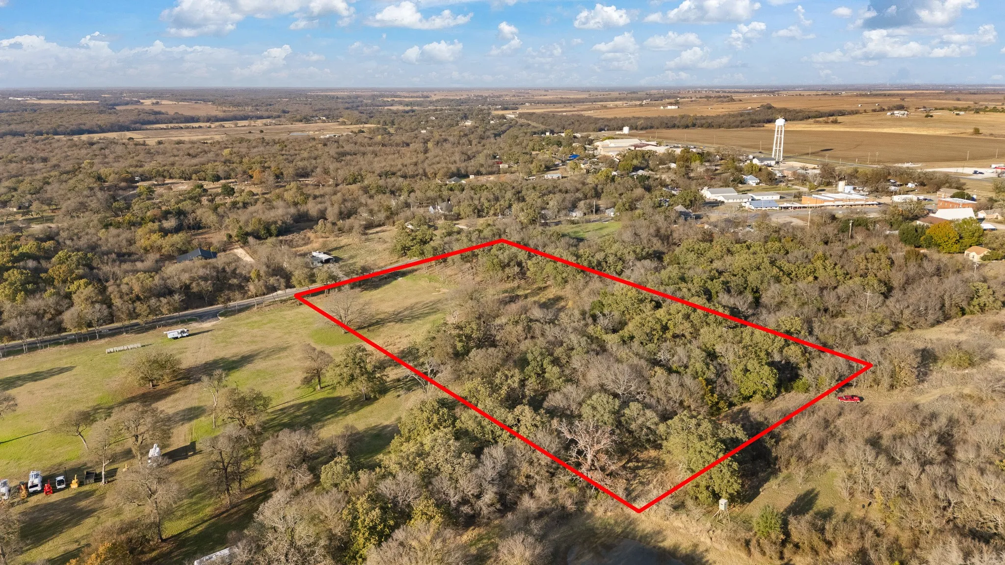 View of property location with property boundaries highlighted and rural landscape