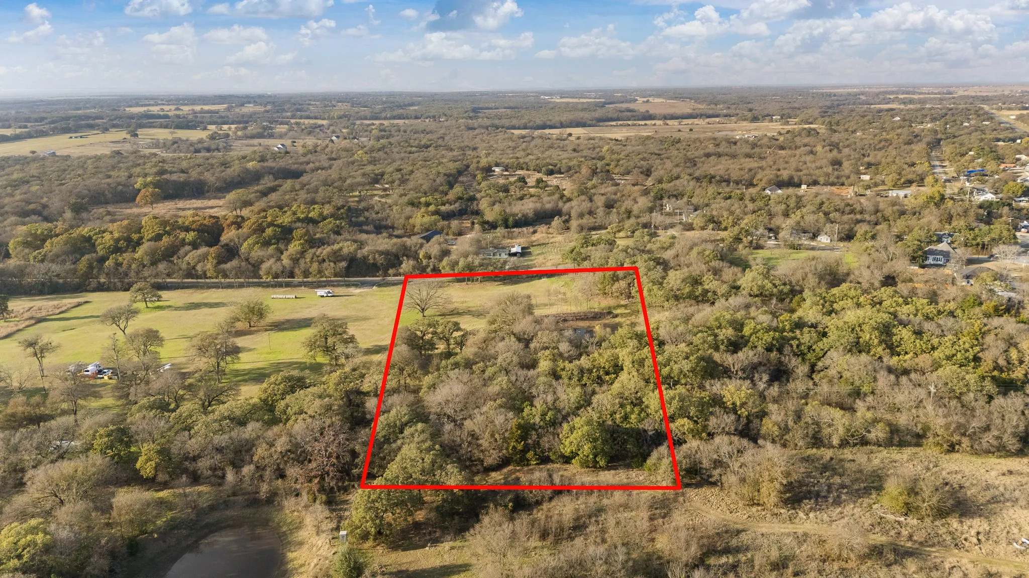 Aerial overview of property's location featuring property boundaries highlighted